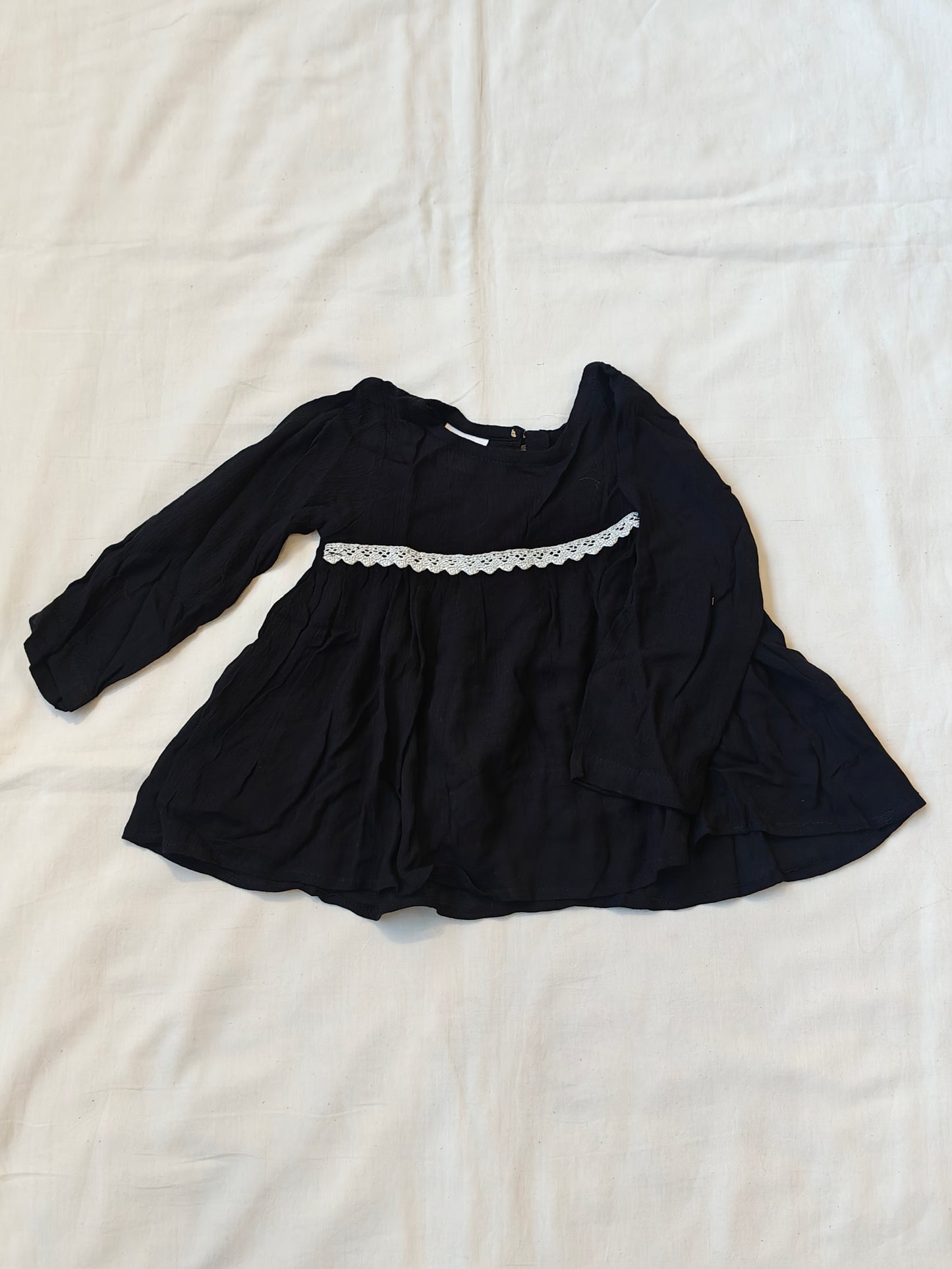 Black long sleeved top with lace detailing for girls