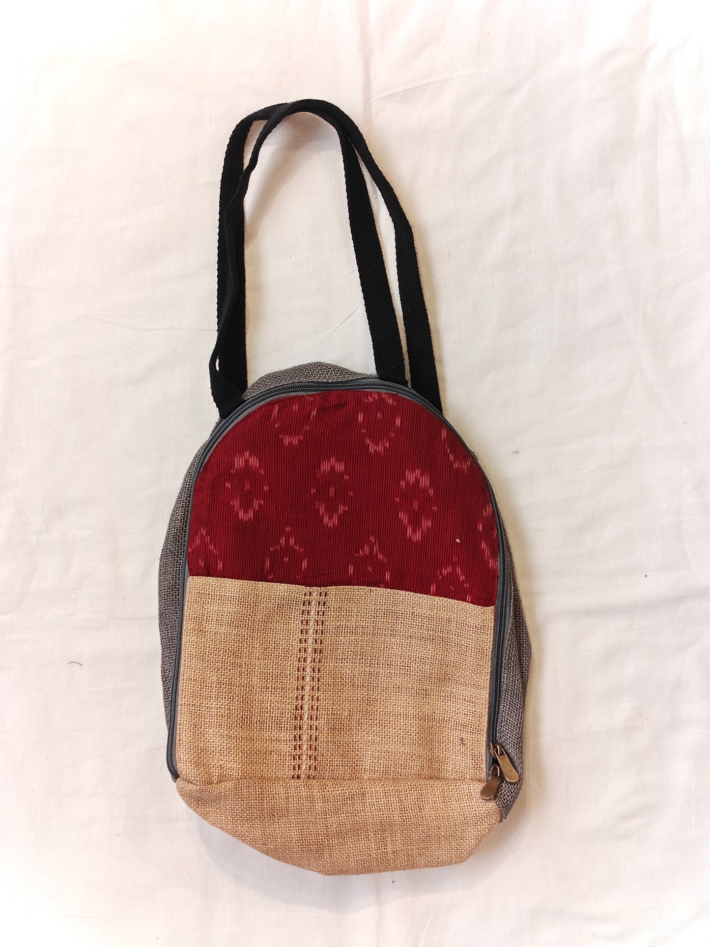 Day back pack cum handbag in jute with fabric panel