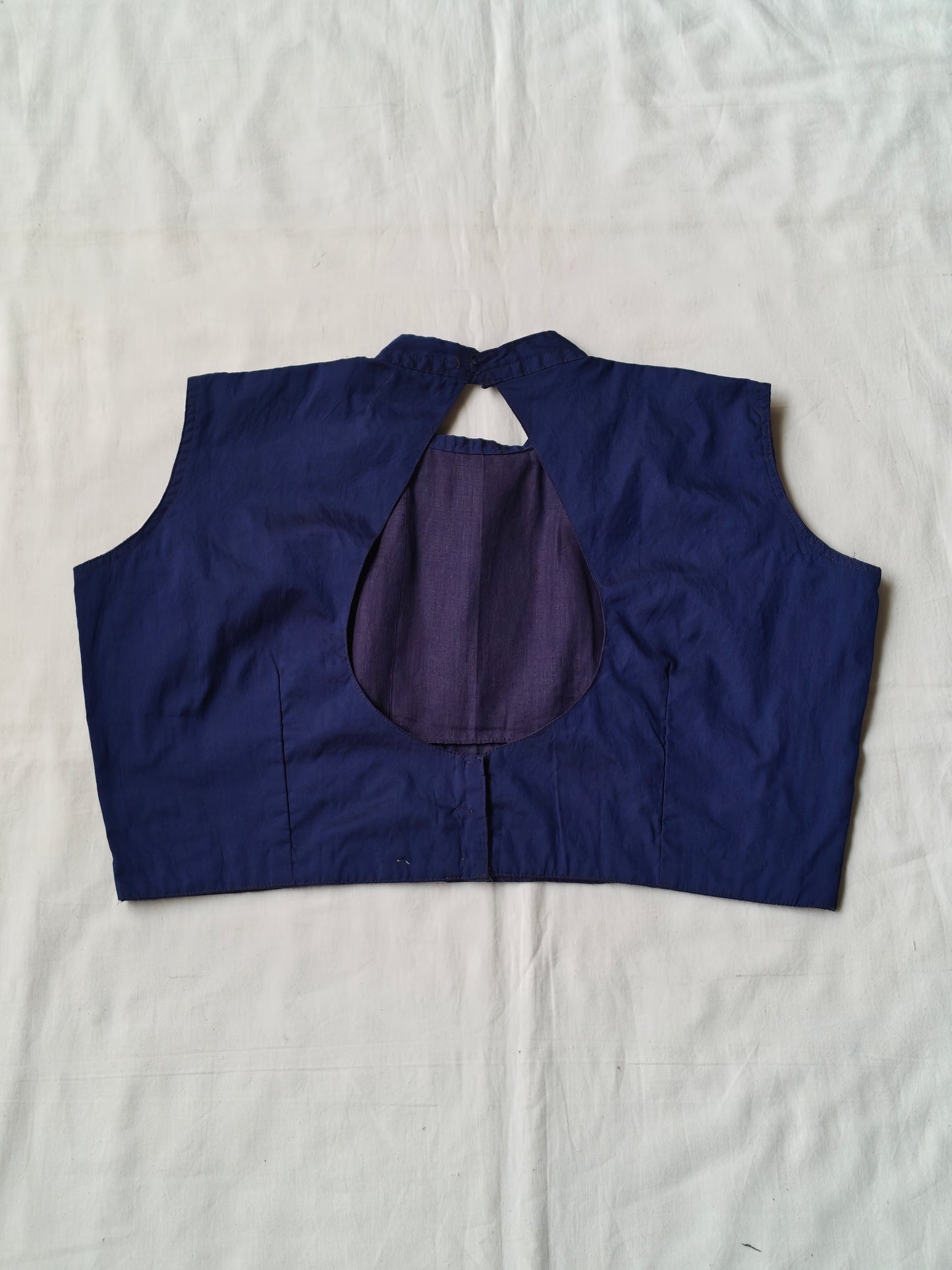 Dark blue collared sleeveless blouse