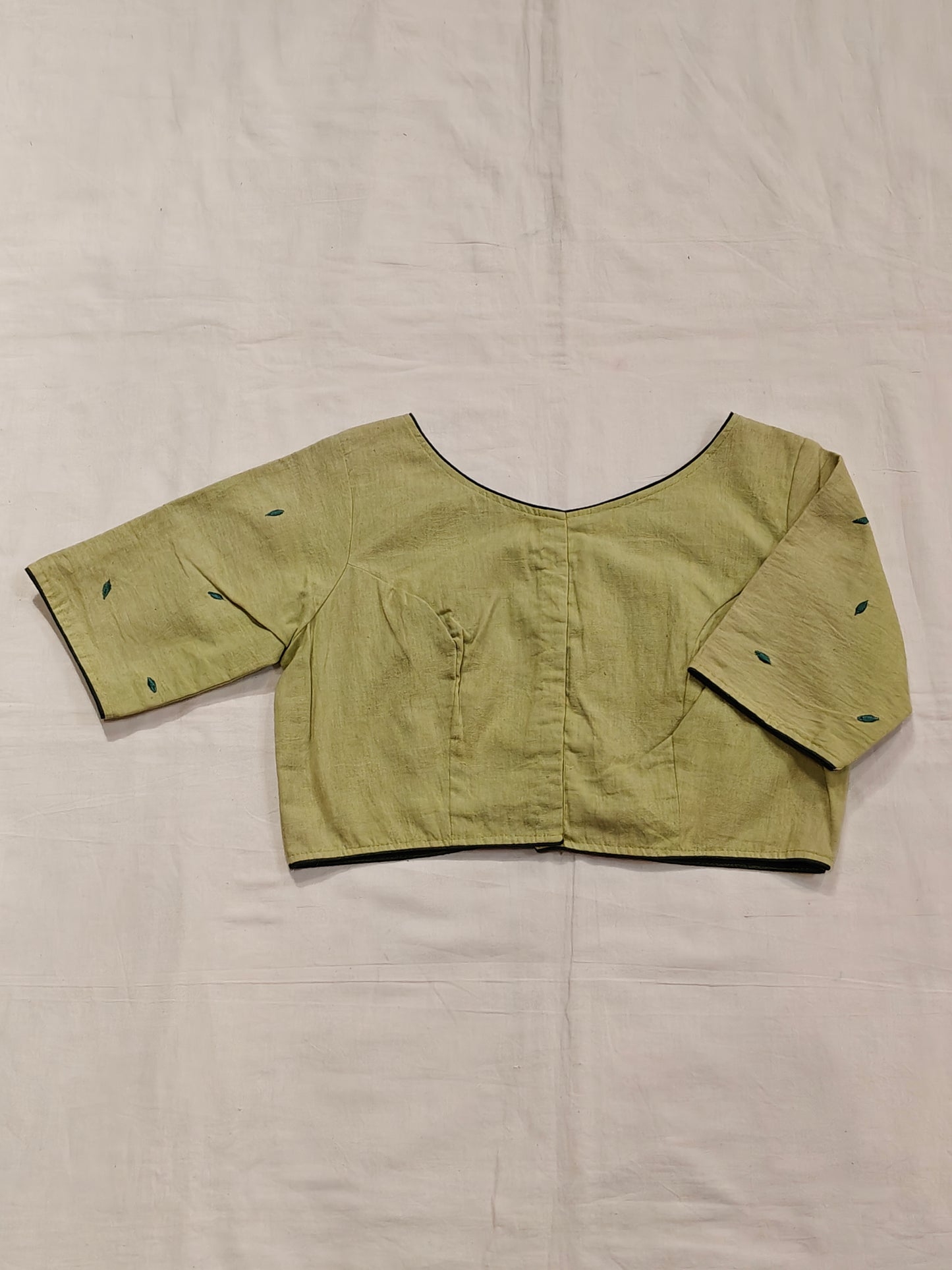 Light green cotton half sleeves blouse with green leaf embroidery back