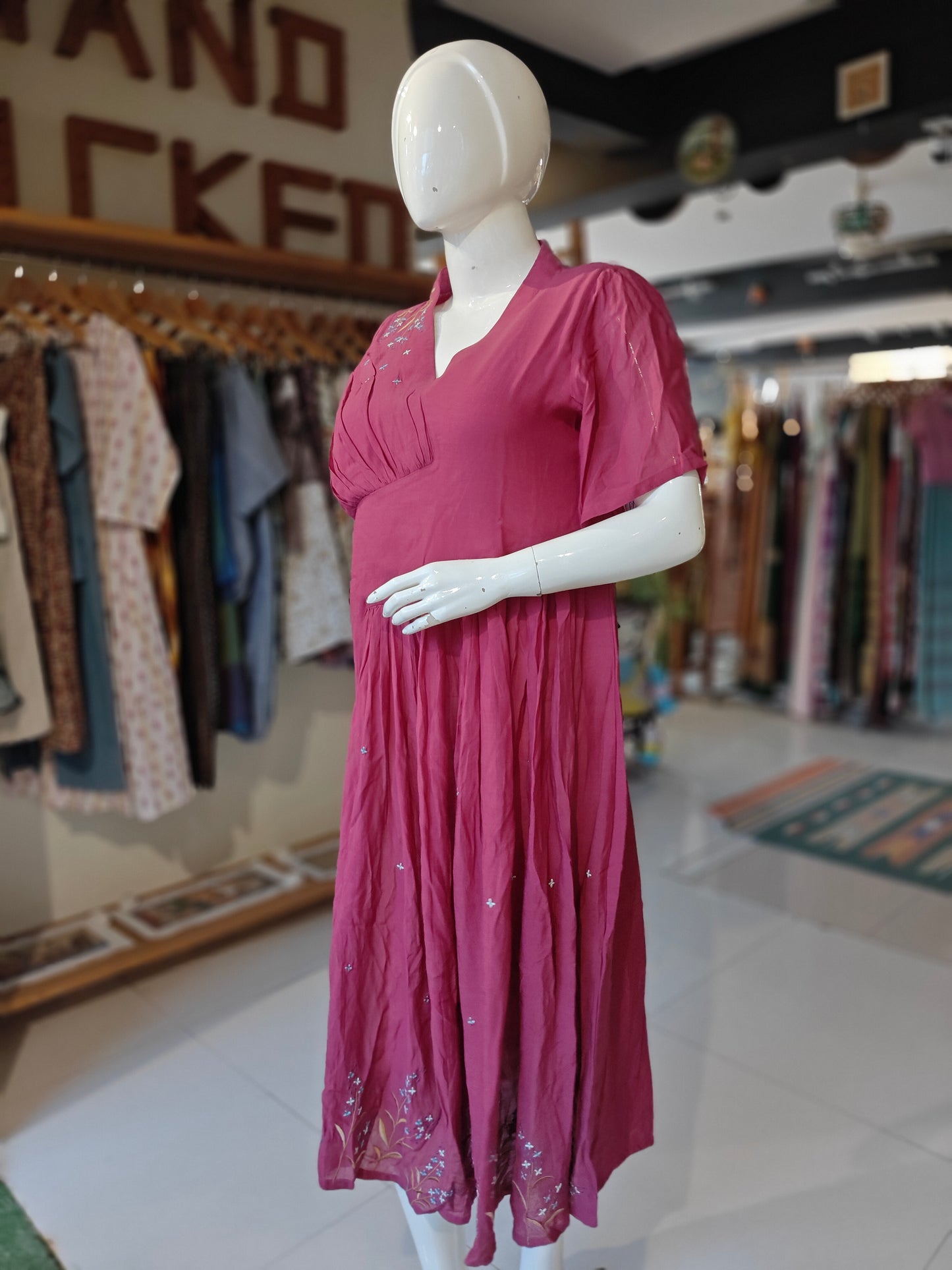 Magenta pleated dress with hand embroidery on shoulder and hem