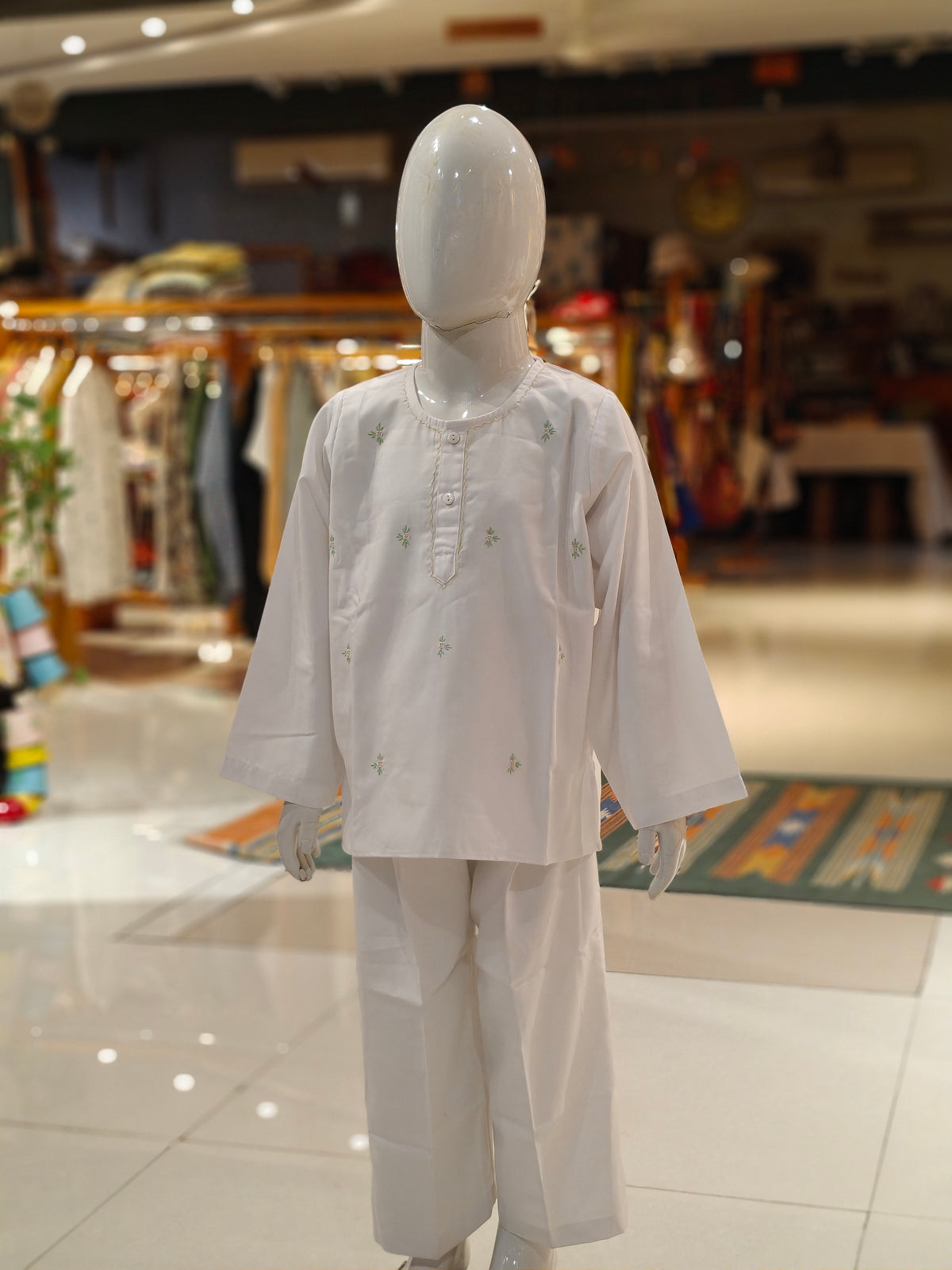 White long kurta pajama set with flower motifs for boys