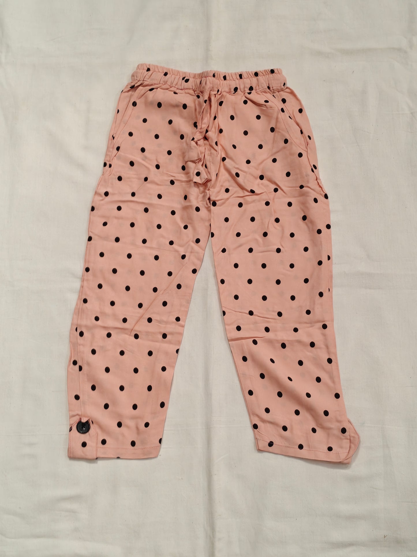 Pink cotton pants with polka dots and drawstring for children