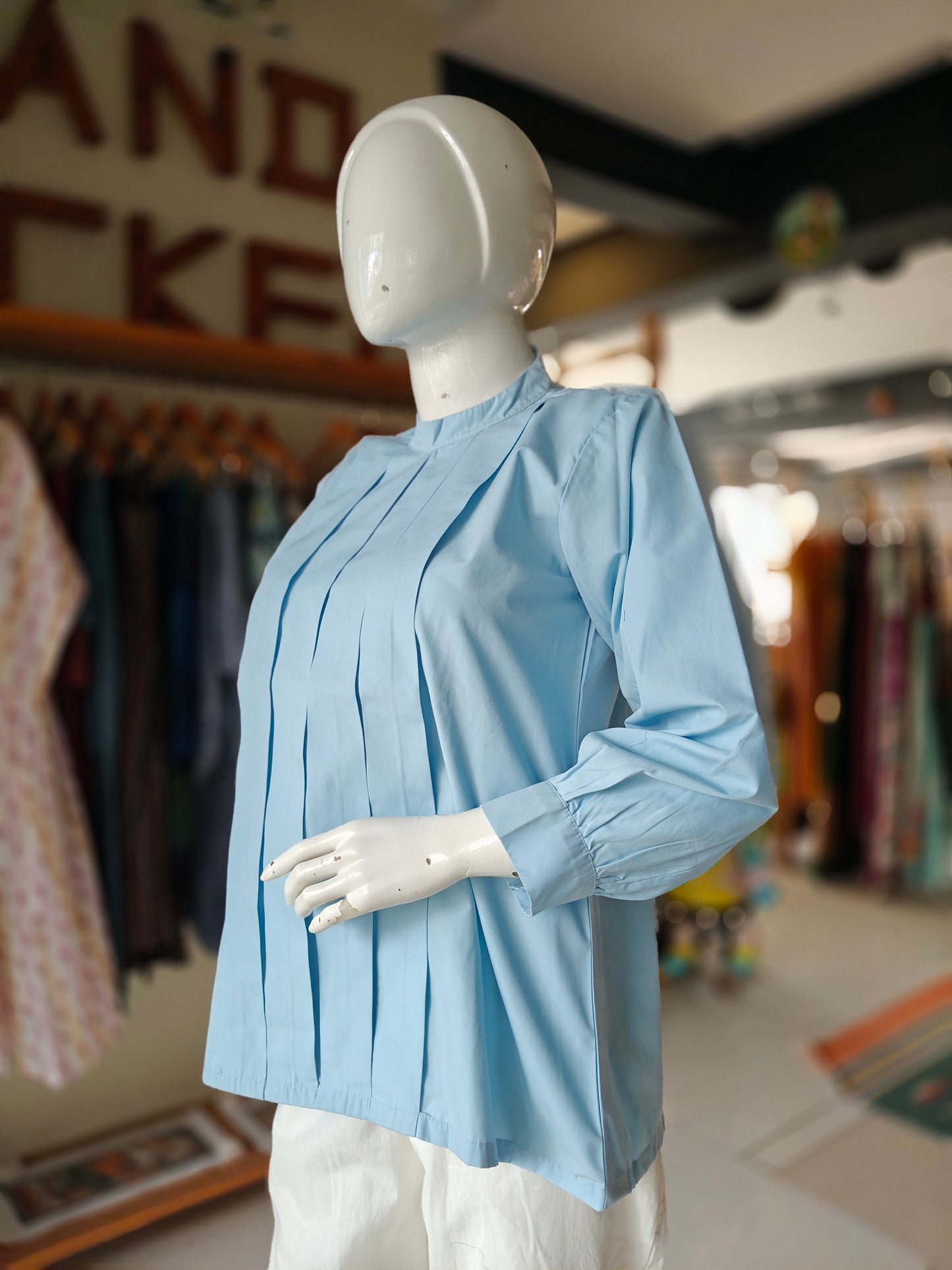 Light blue pleated band collared top