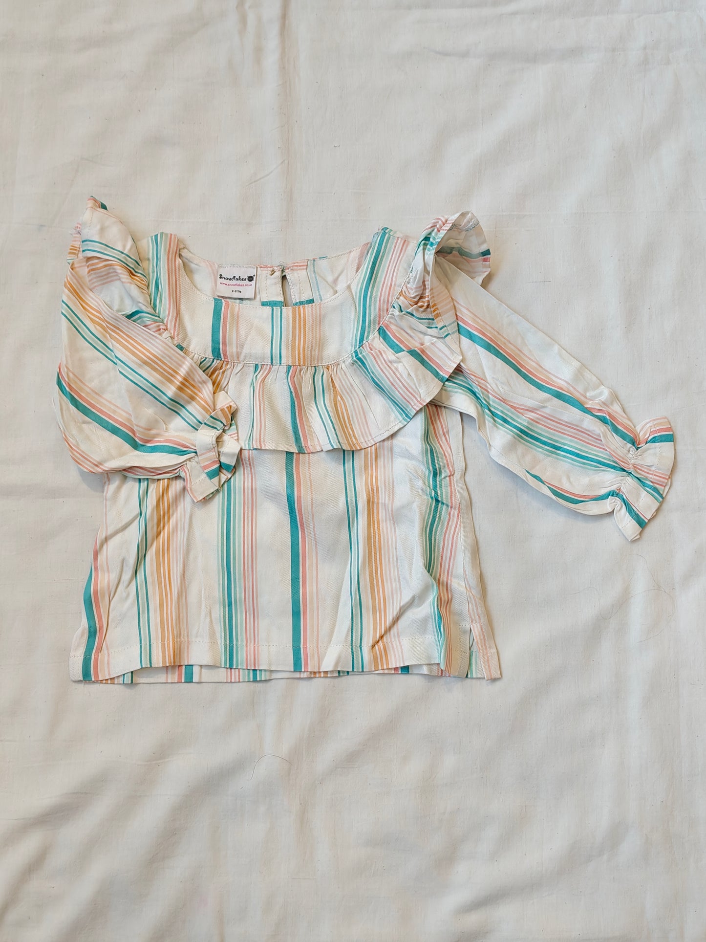 White with colorful striped top with ruffled neck and sleeves