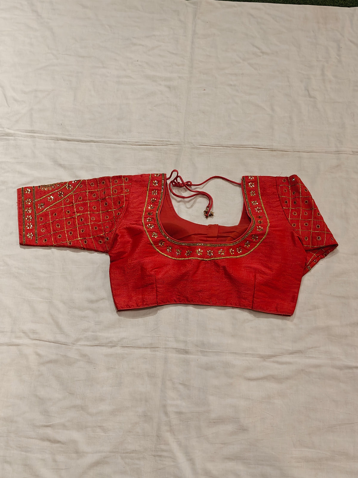 Blouse with golden embroidery and stonework on sleeves and half neck