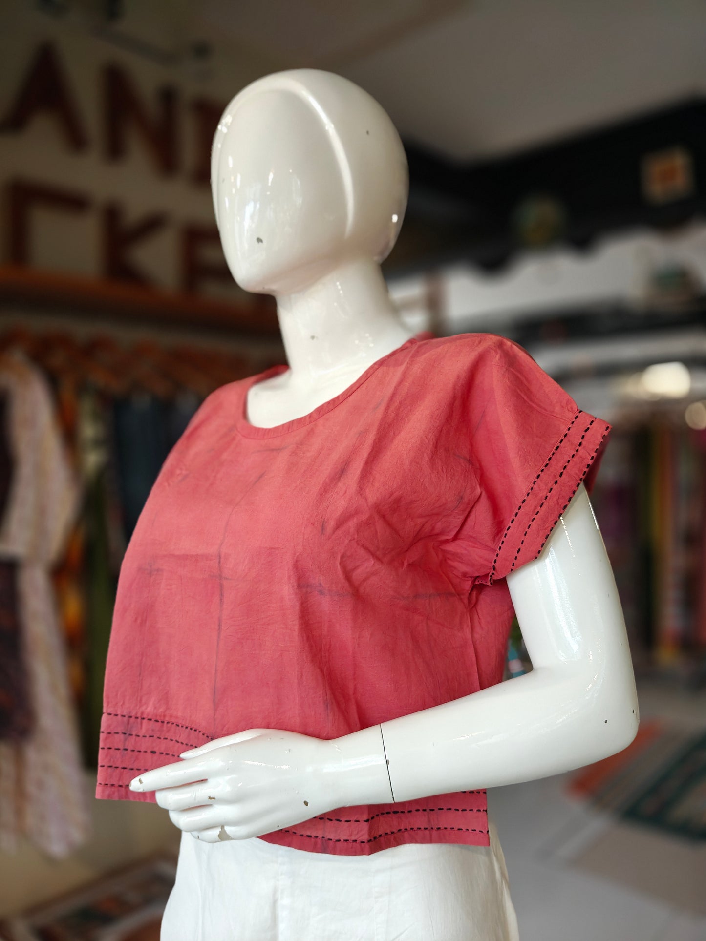Red cotton top with kantha embroidery on hem and sleeves