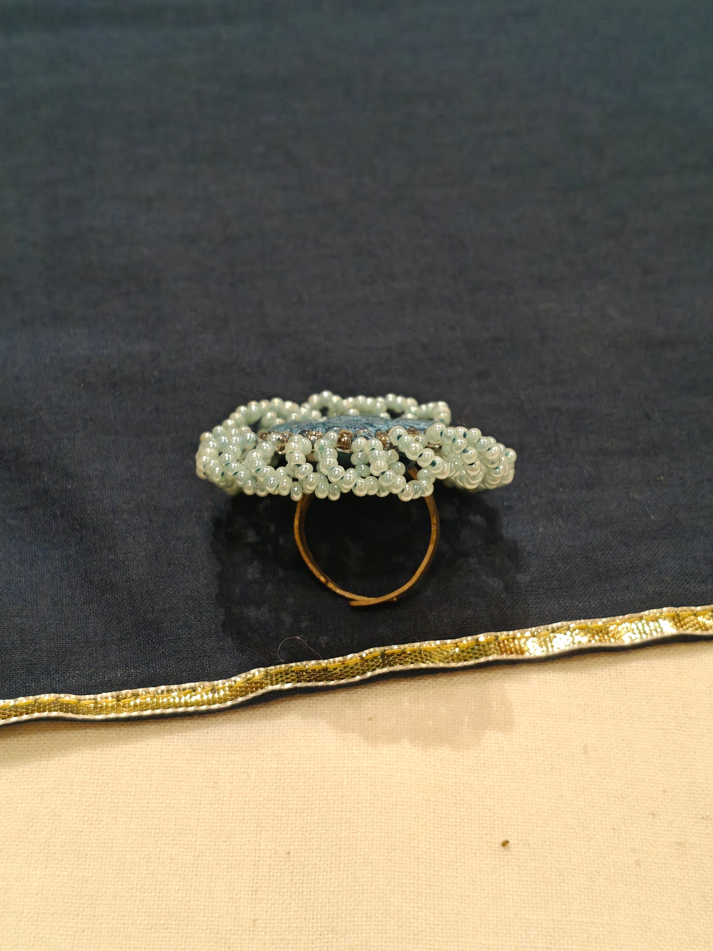 Handcrafted finger ring with bead work and mirror