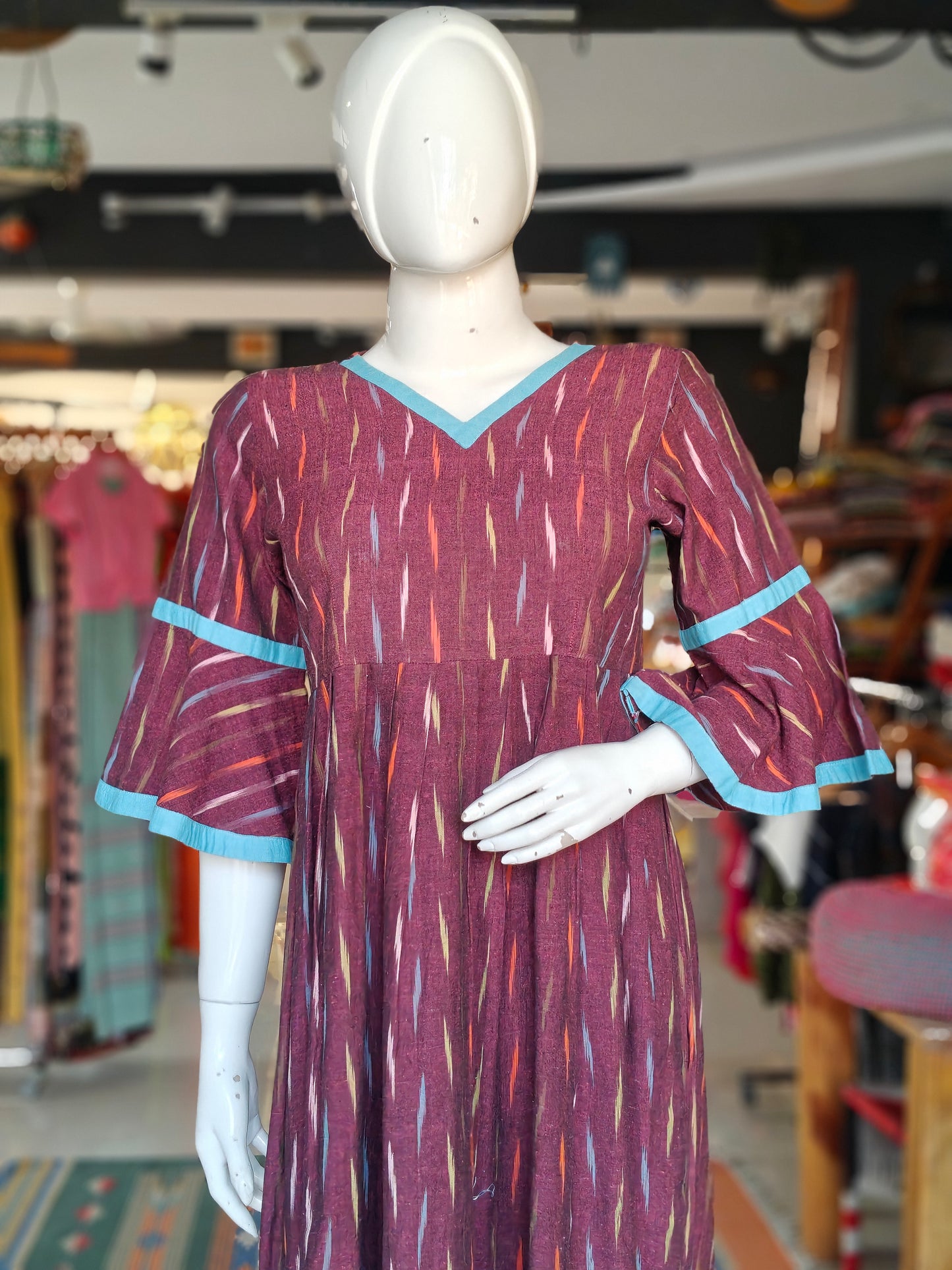 Maroon with multicolour ikat dress with bell sleeves and blue accents