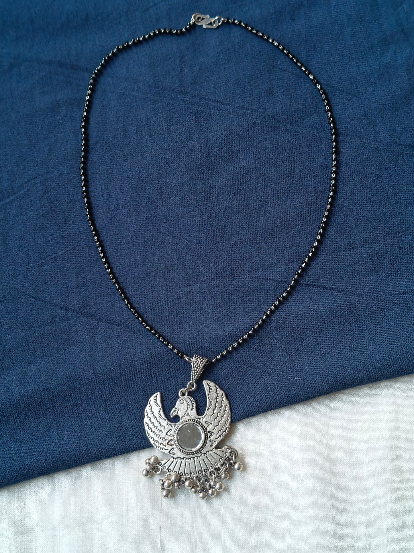 Falcon shaped oxidised silver look pendant black beads necklace