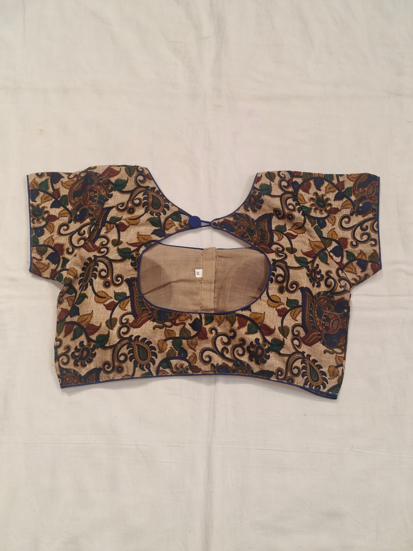 Kalamkari prints with peacock on cream base silk blouse