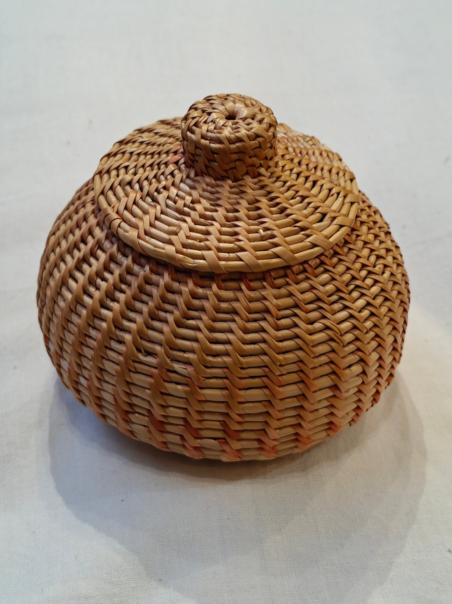 Handcrafted storage basket with lid