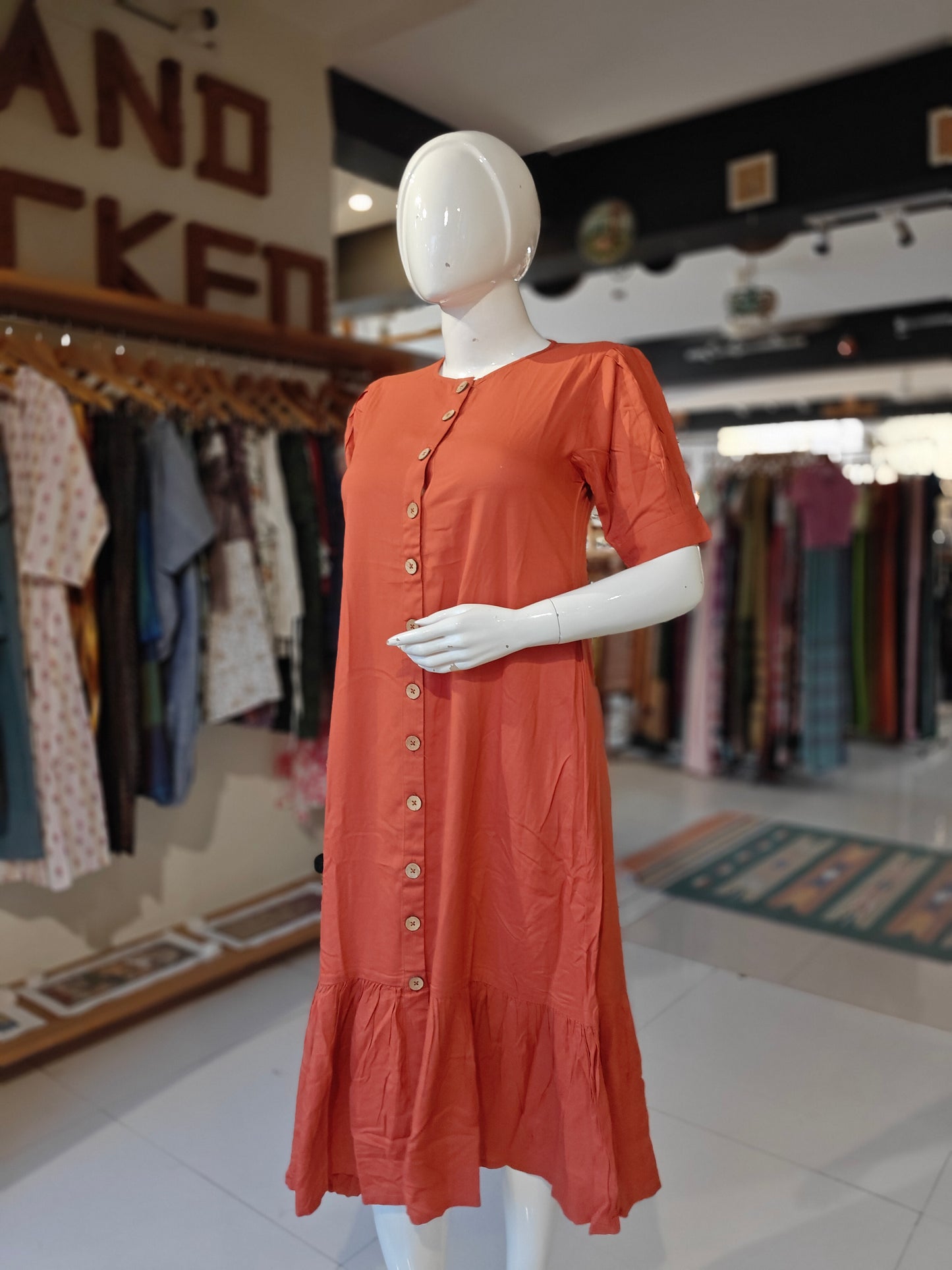 Plain rust orange button down rayon dress with frills at hem
