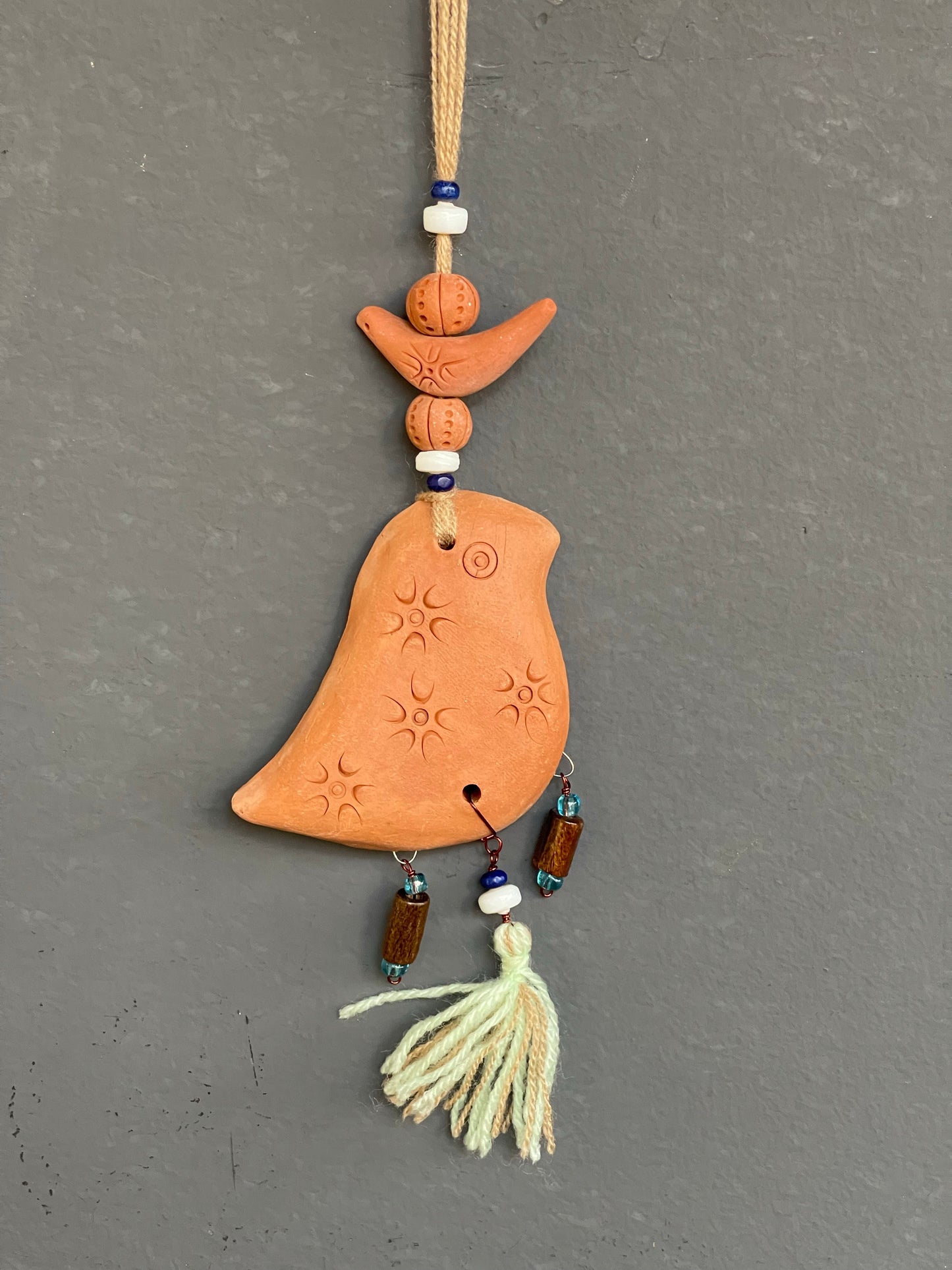 Terracotta bird car hanging cream tassle
