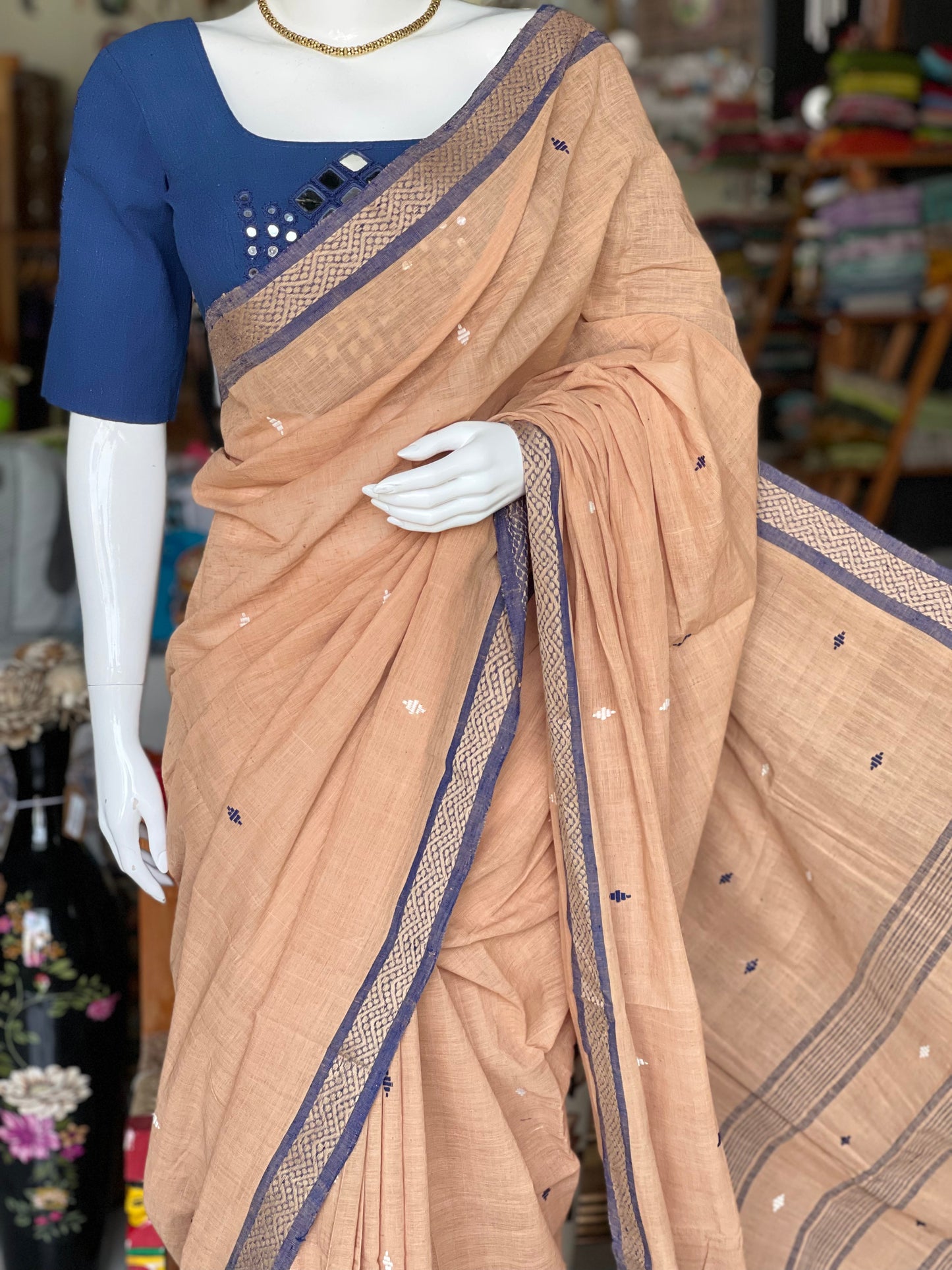 Earthy tone handloom cotton saree with small butis and indigo border
