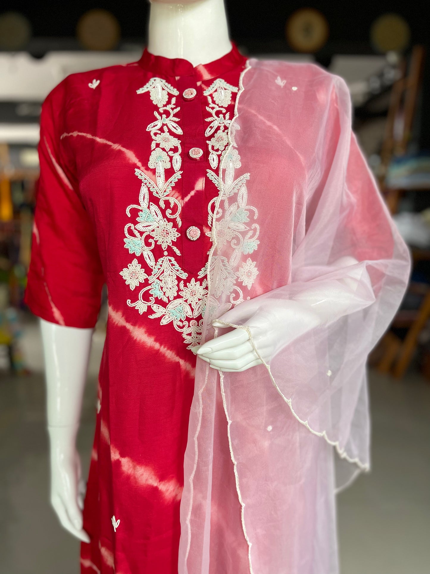 Red lehariya print dola silk suit set with hand embroidery and organza dupatta