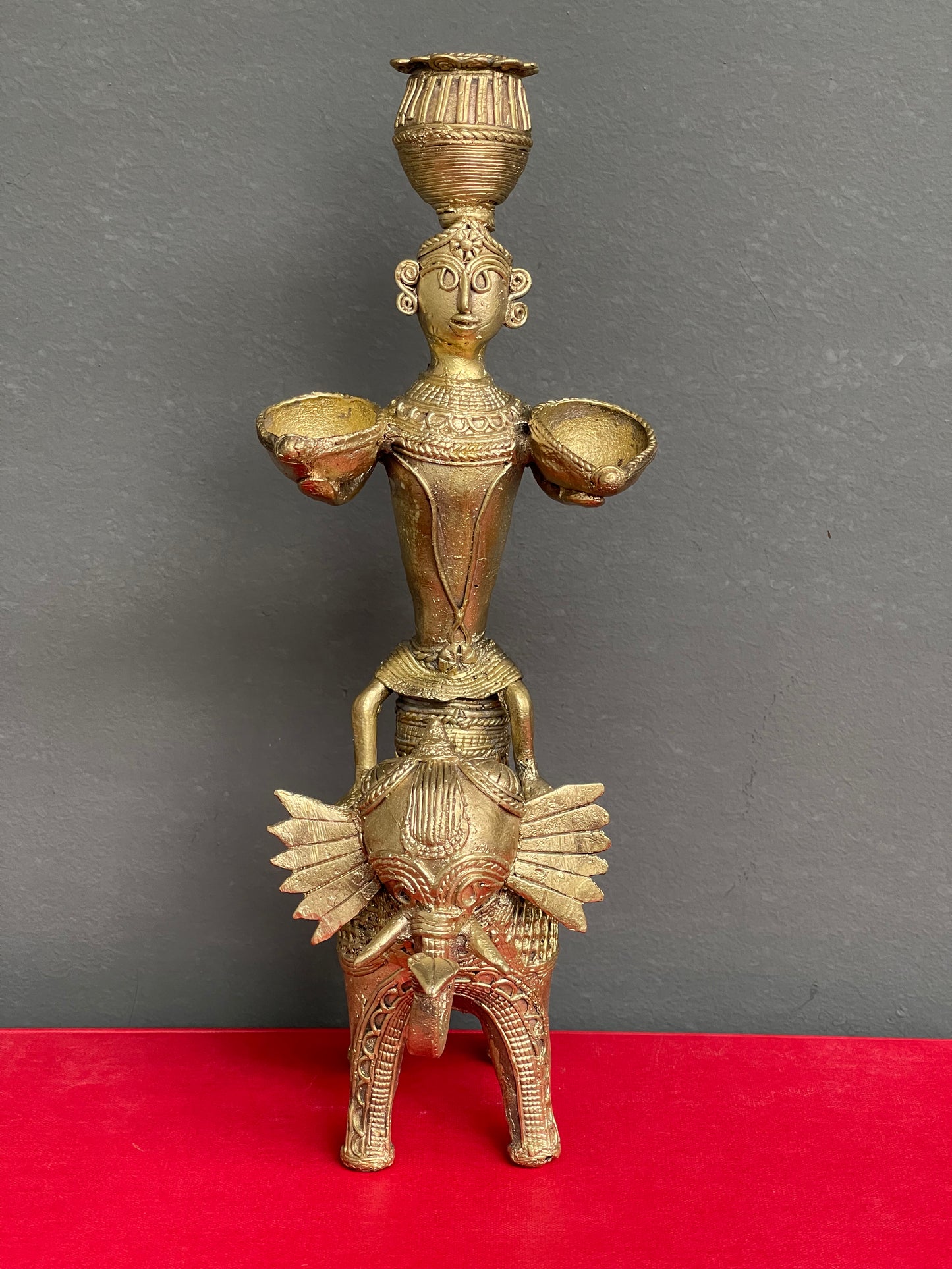 Dokra brass man on elephant holding diyas