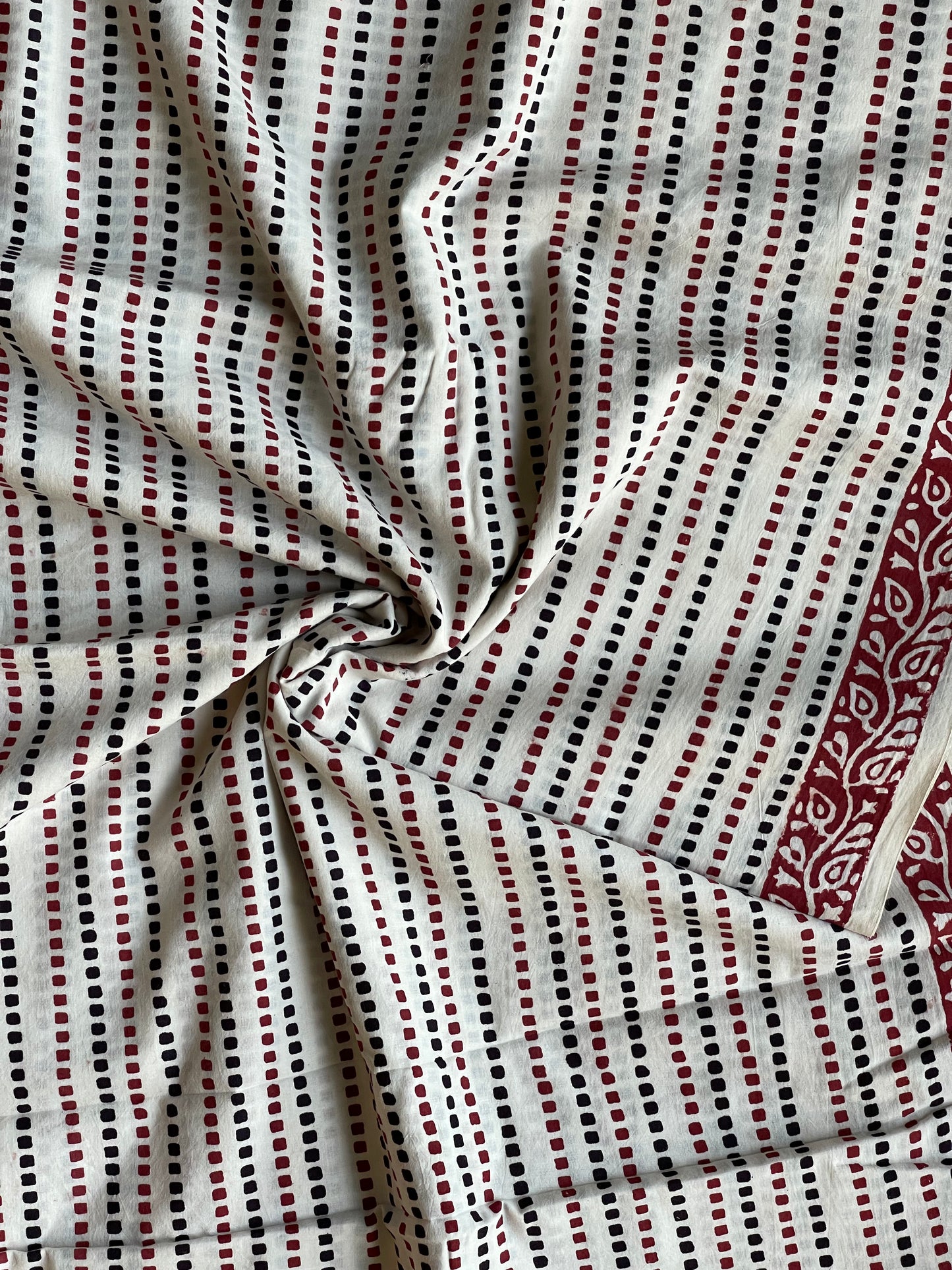 Off white squarish dots hand block printed cotton fabric with border