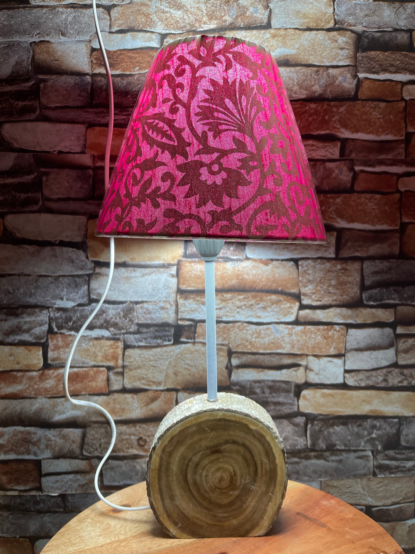 Pink and gold lamp shade with wooden base