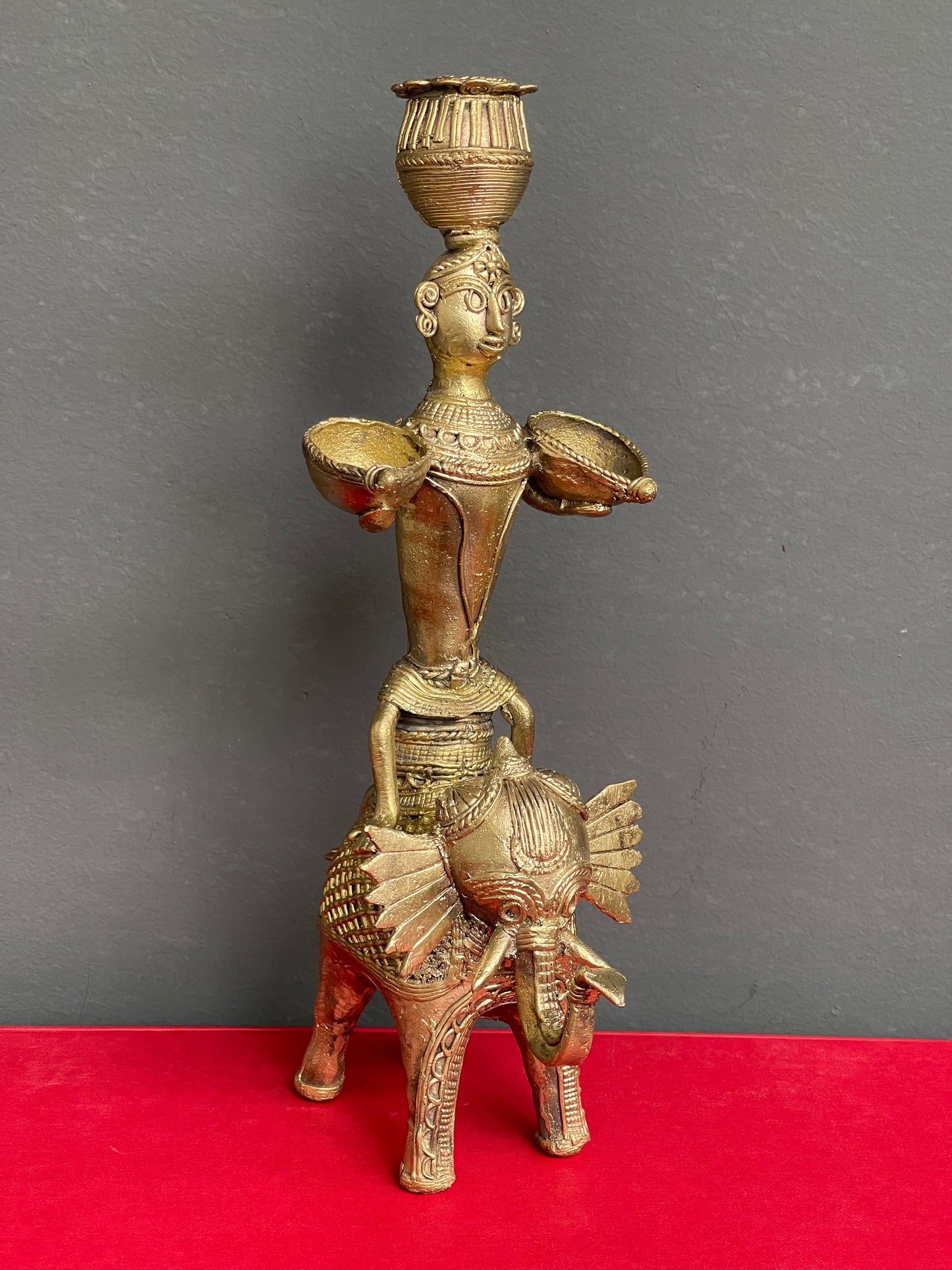 Dokra brass man on elephant holding diyas