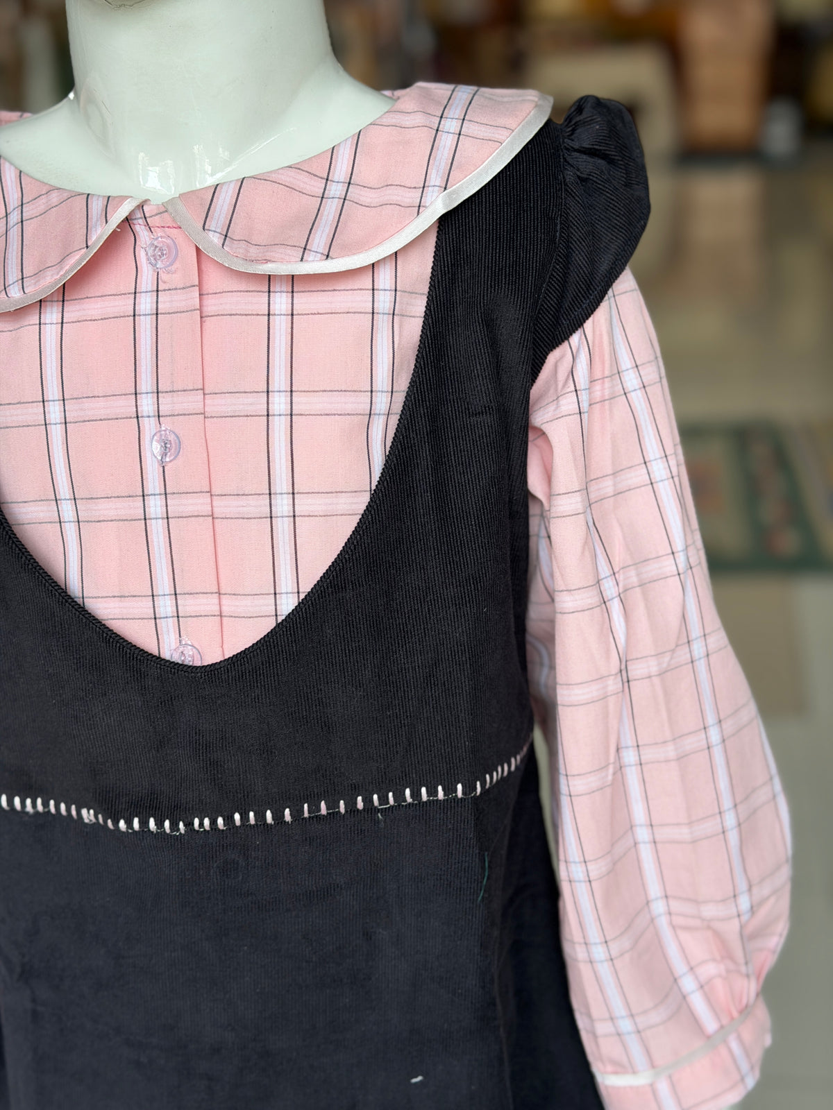 Black corduroy pinafore dress with pink checks collared shirt for girls