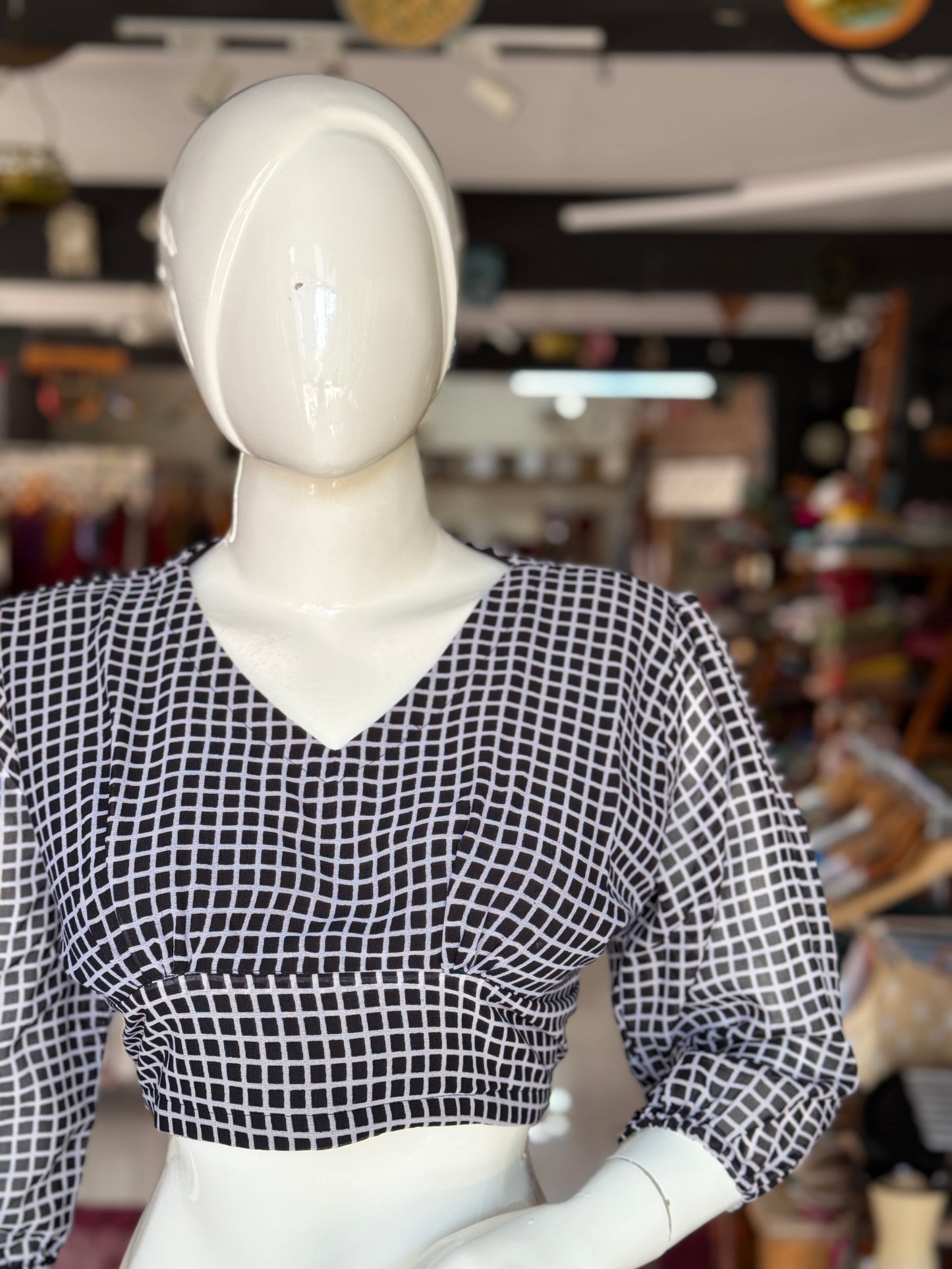 Georgette smart black checkered blouse with long sleeves