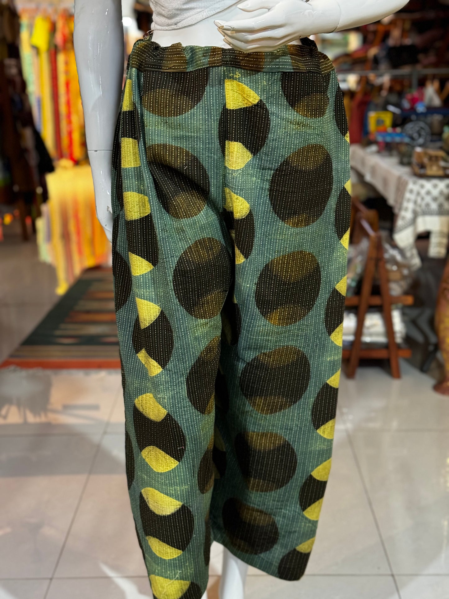 Green cotton hand block printed pants with black and yellow circular Ajrakh hand block prints