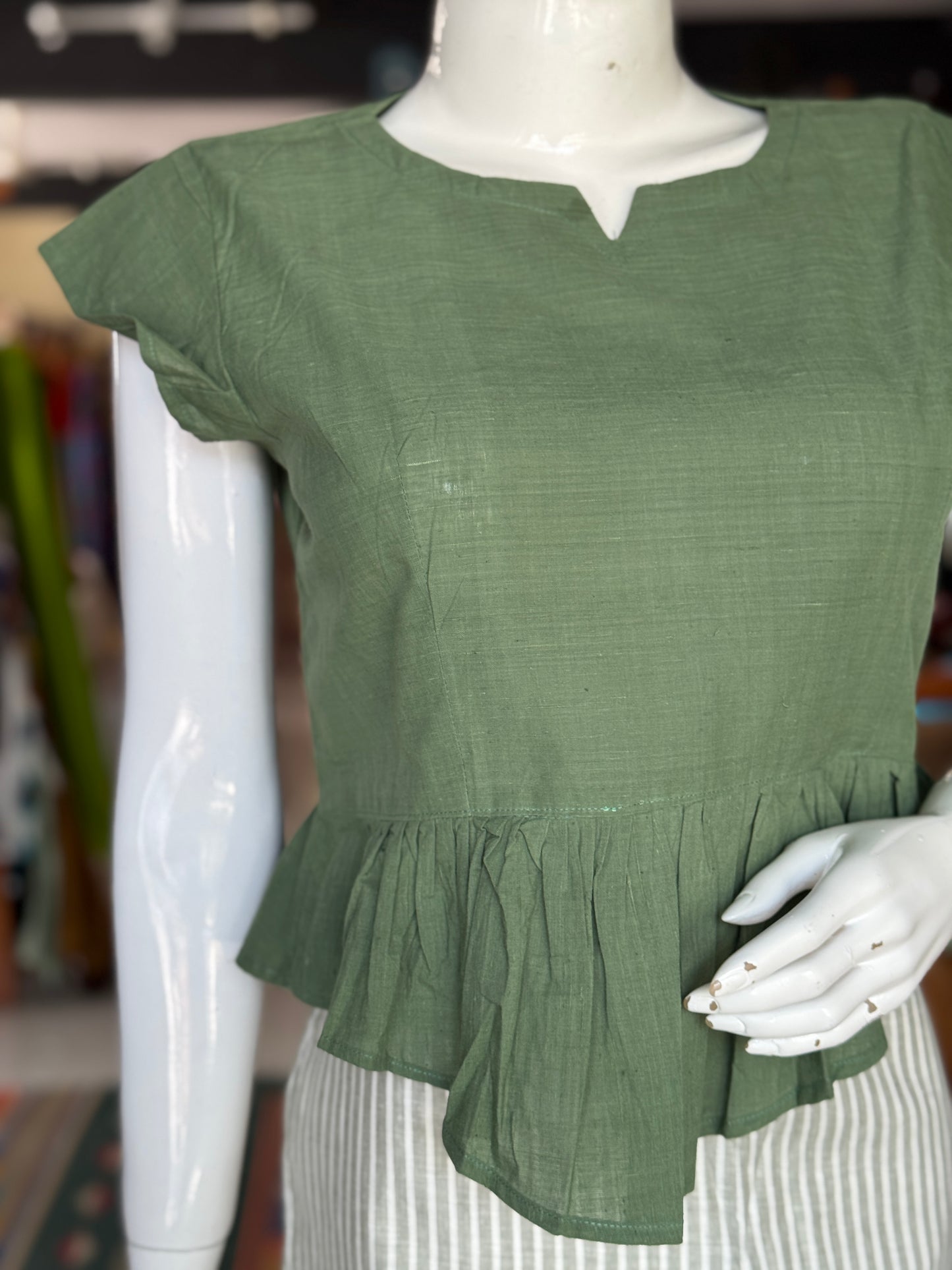 Green cotton handloom top with high low pleated hem