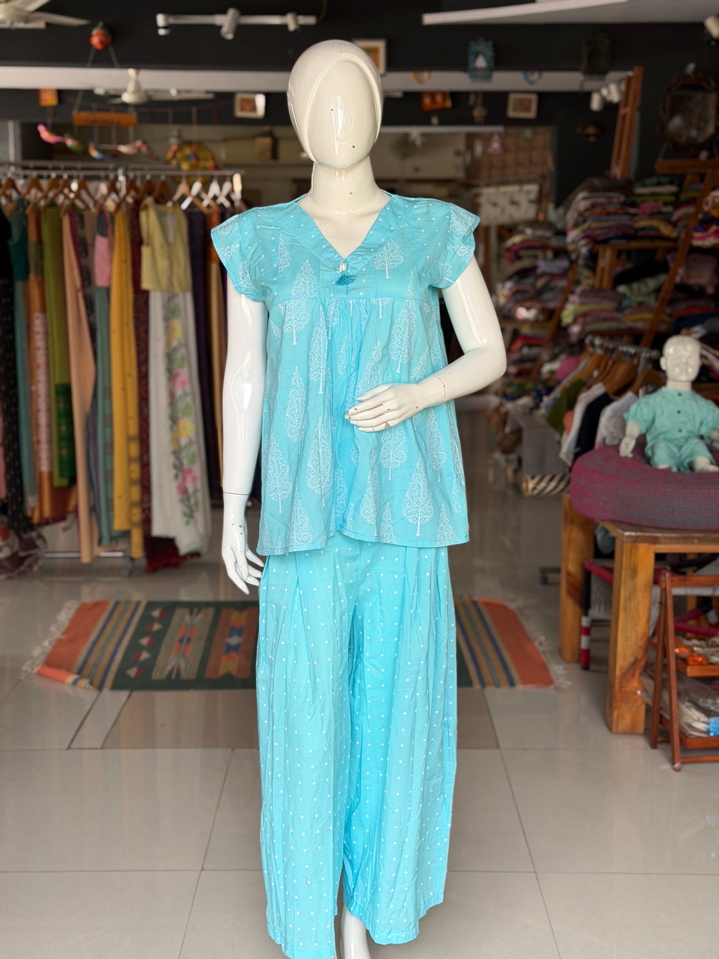 Blue dots and cypress print pleated cotton top with cowrie shell button