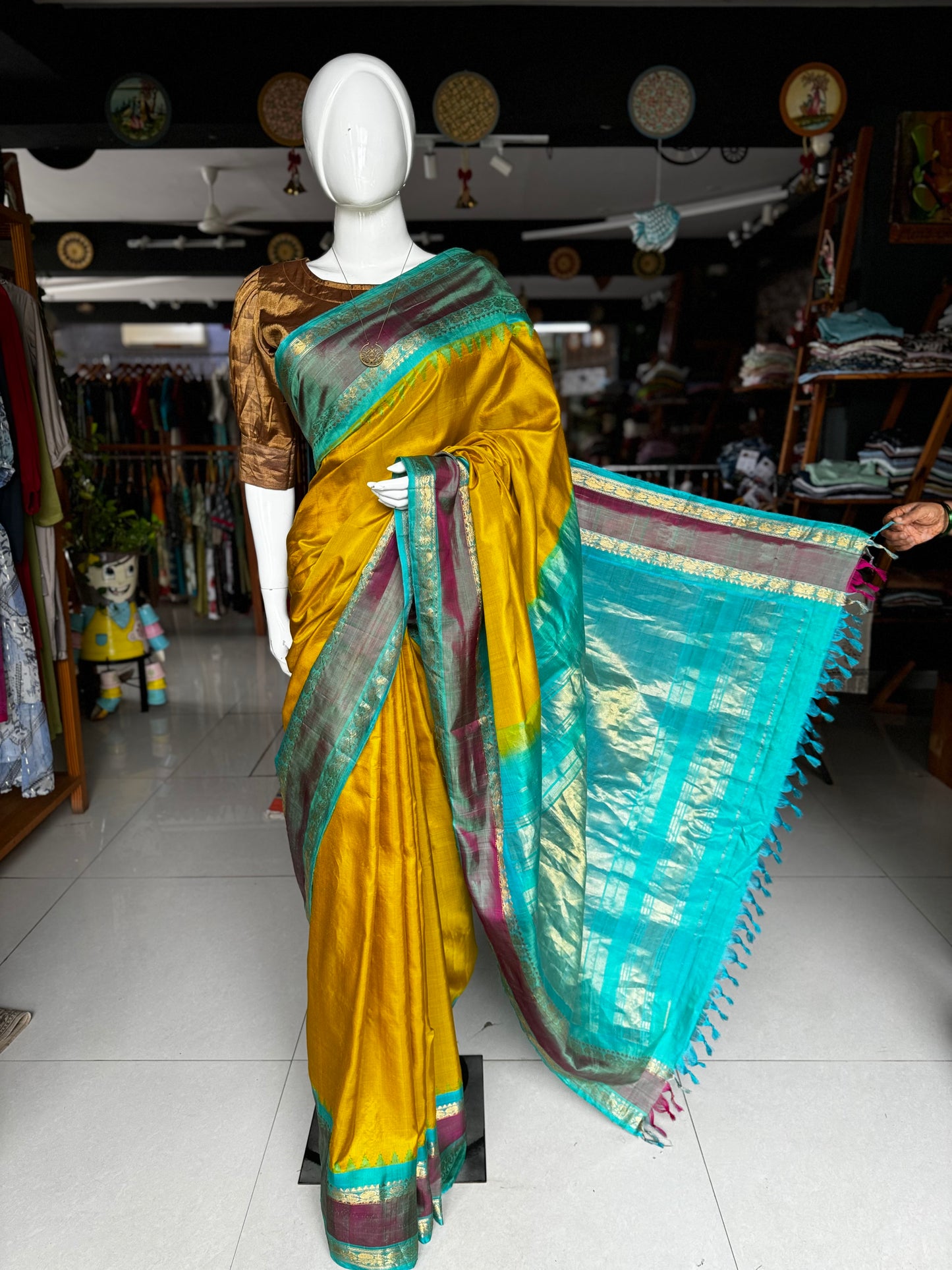 Beautiful mustard and green combination pure silk handwoven Gadwal saree with temple borders