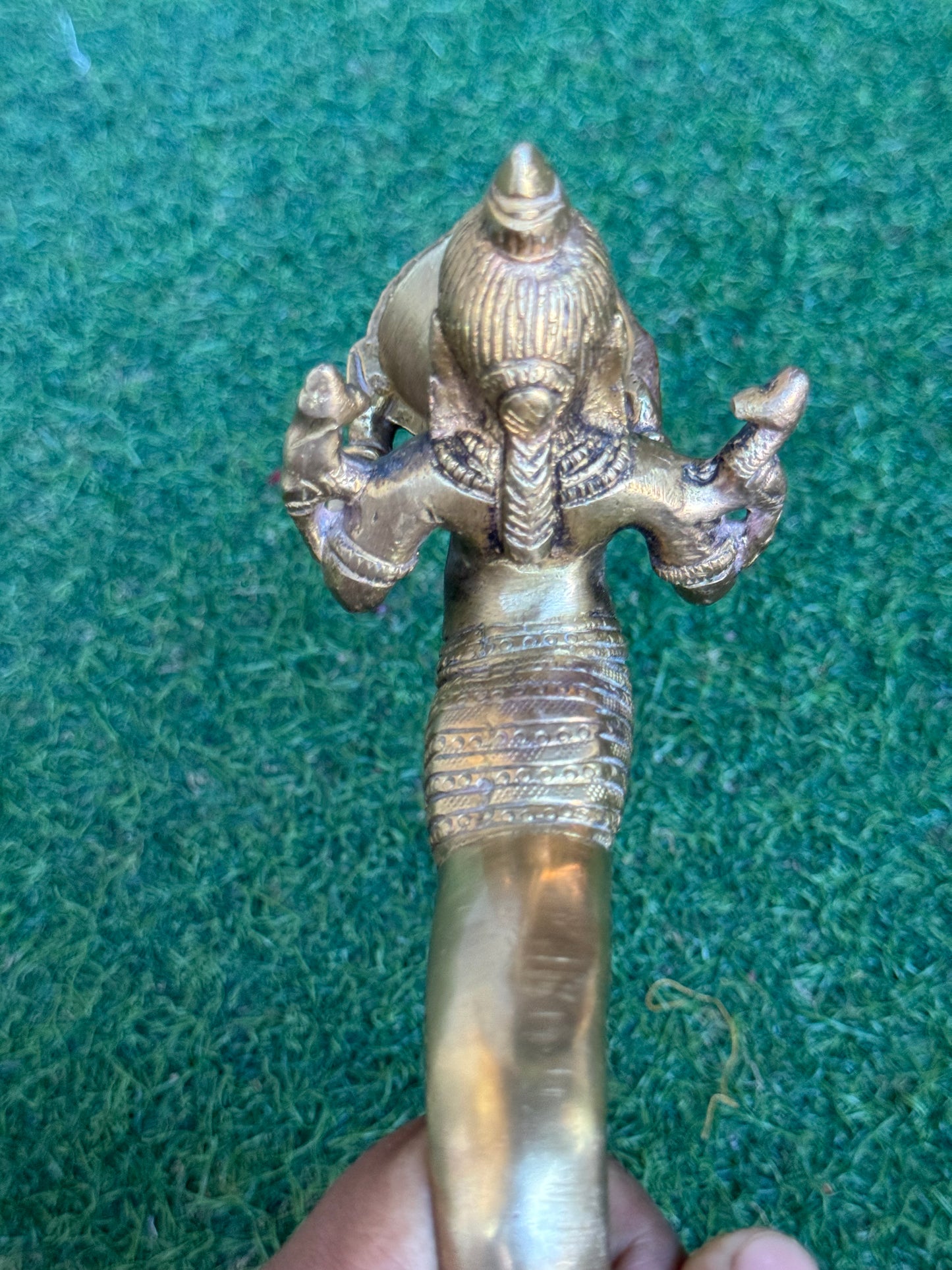 Lady holding Diya with long mermaid handle - handcrafted in brass