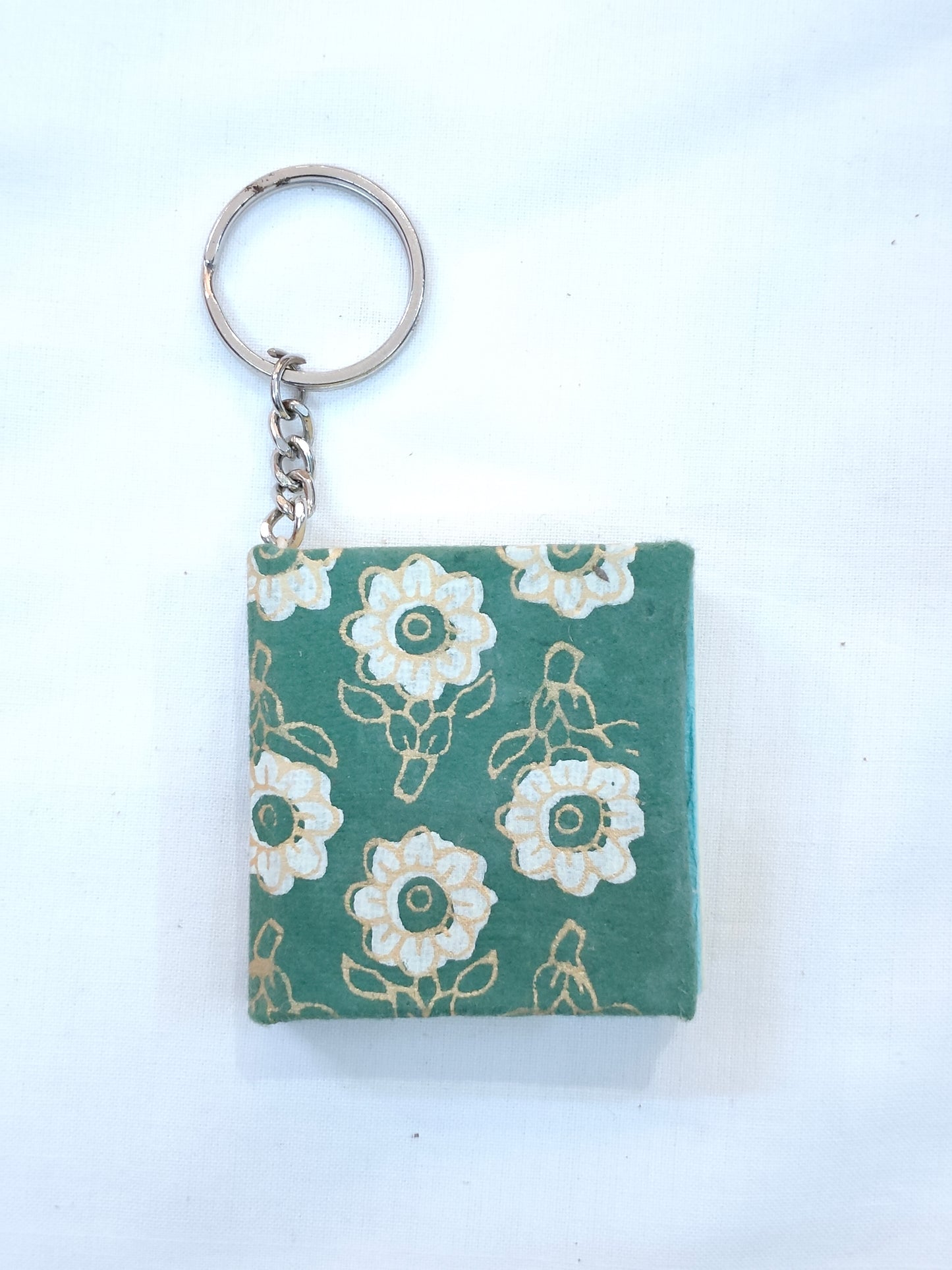 Key ring with small hand made paper notebook