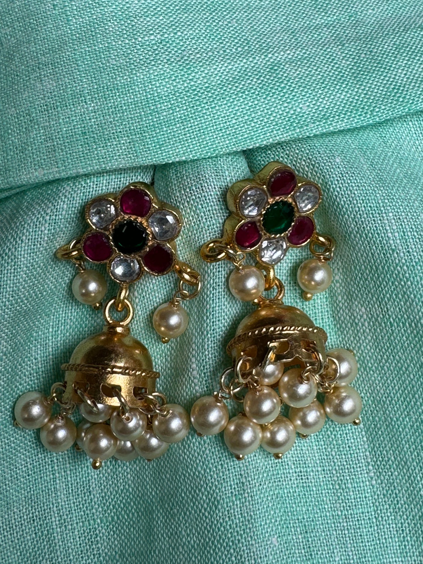 Colourful Kundan studded round studs with gold polish jhumka earrings and pearl drops in 92.5 sterling silver