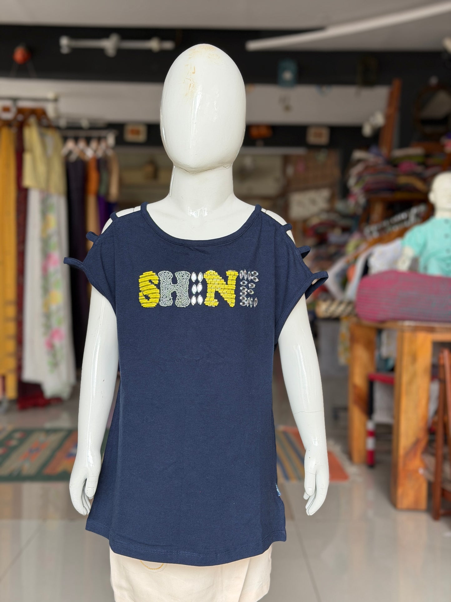 Navy blue “shine” t-shirt top with embroidered letters and strappy sleeves and shoulder