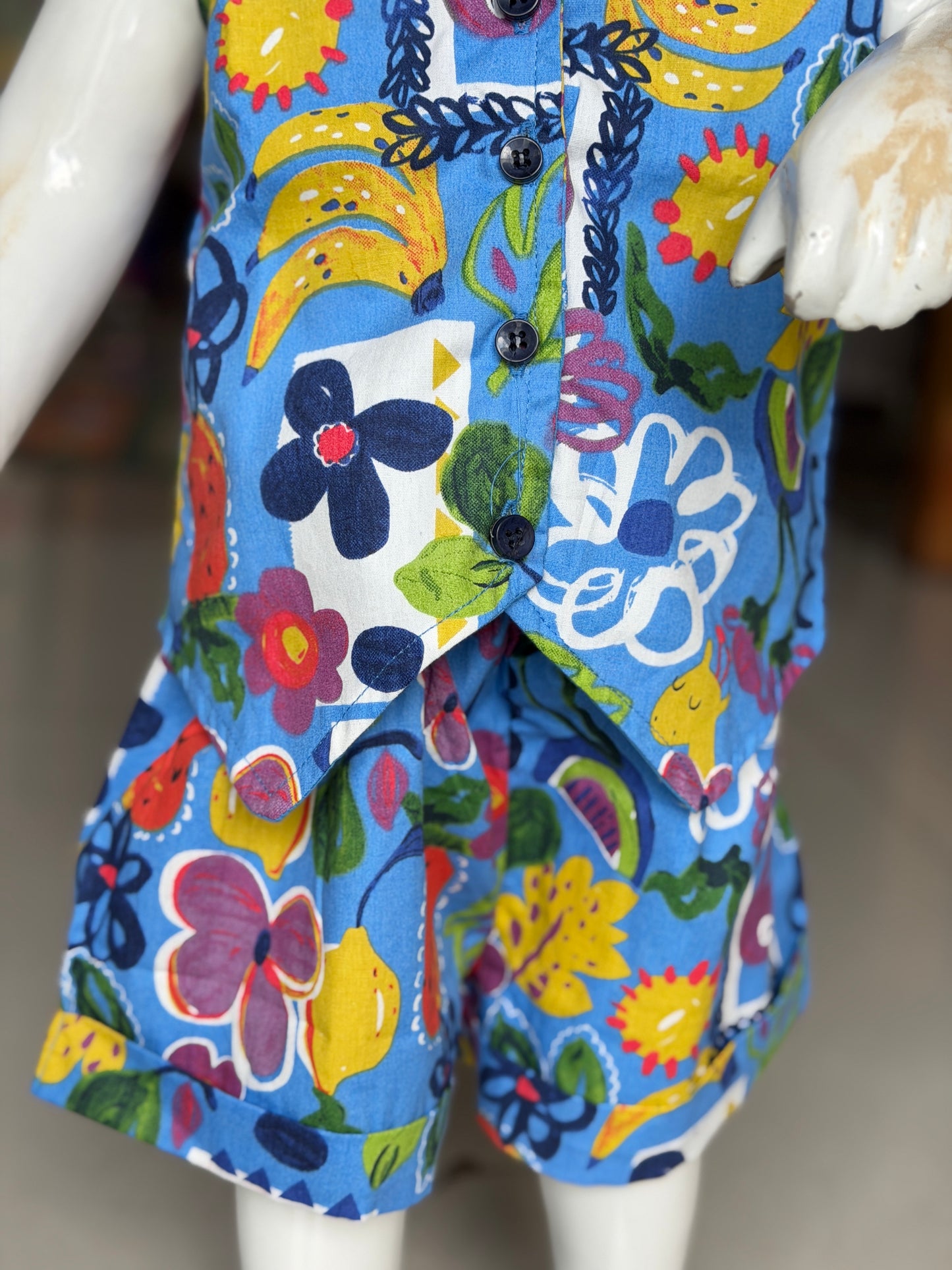 Blue flora and fauna print collared sleeveless crop top and shorts coord set