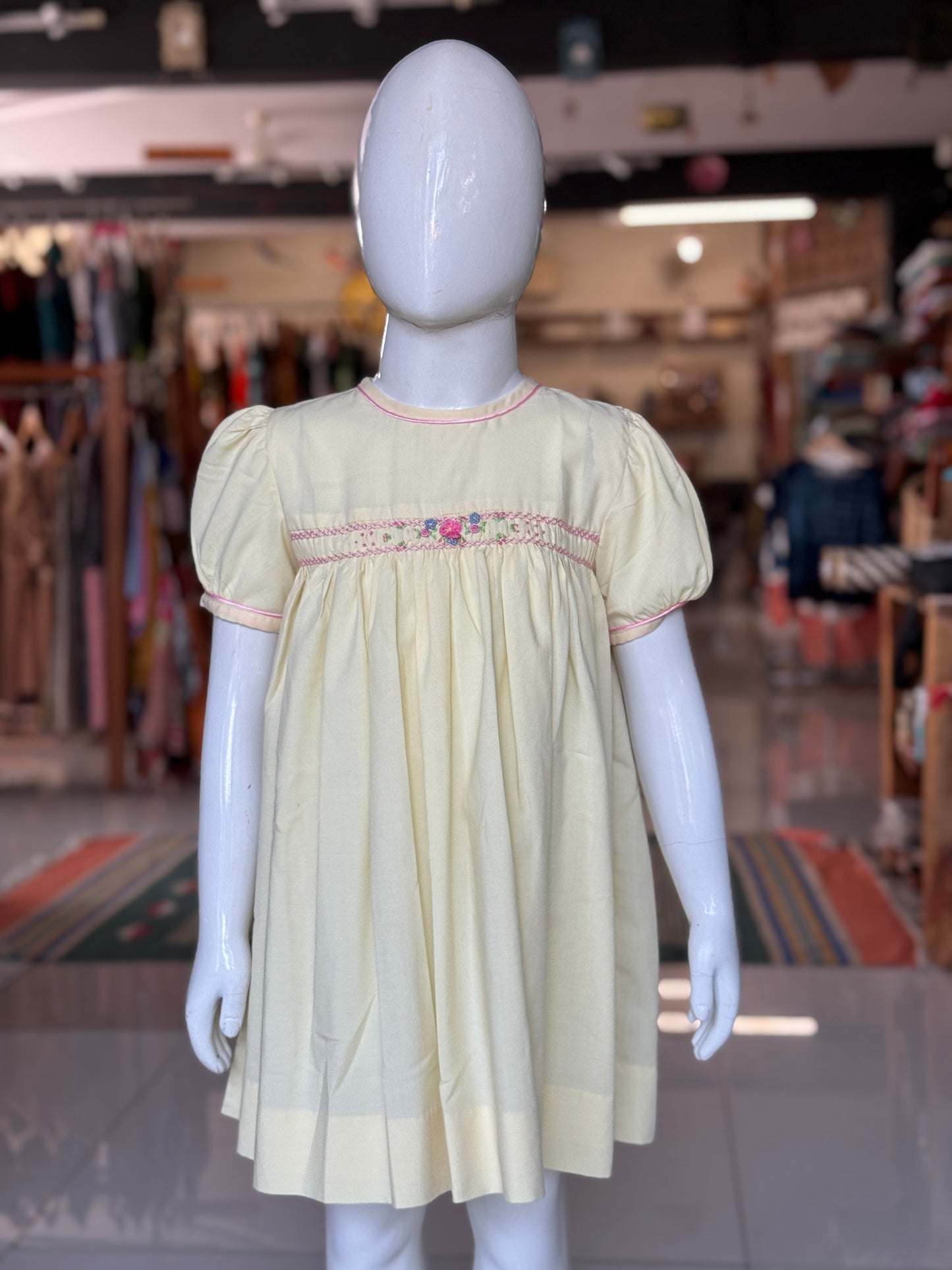 Light yellow hand embroidered smocking frock for girls