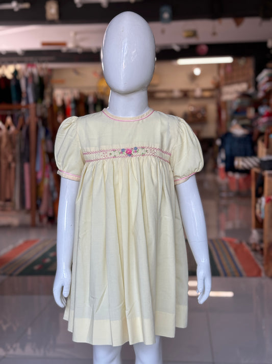 Light yellow hand embroidered smocking frock for girls