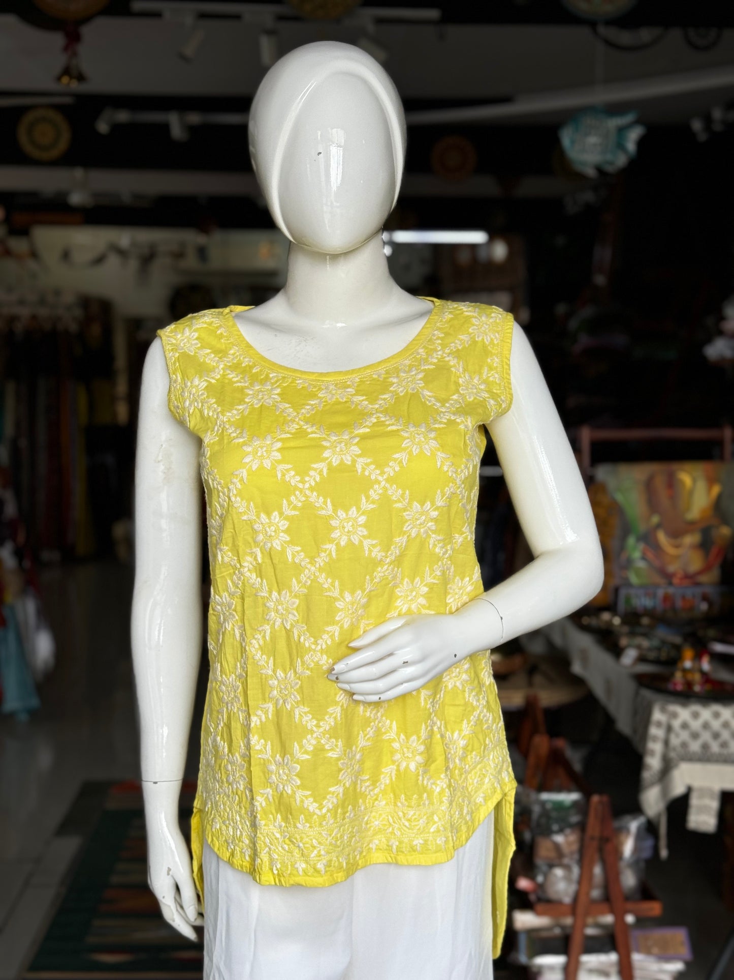 Lemon yellow cotton Chikankari hand embroidered sleeveless high low top with back buttons