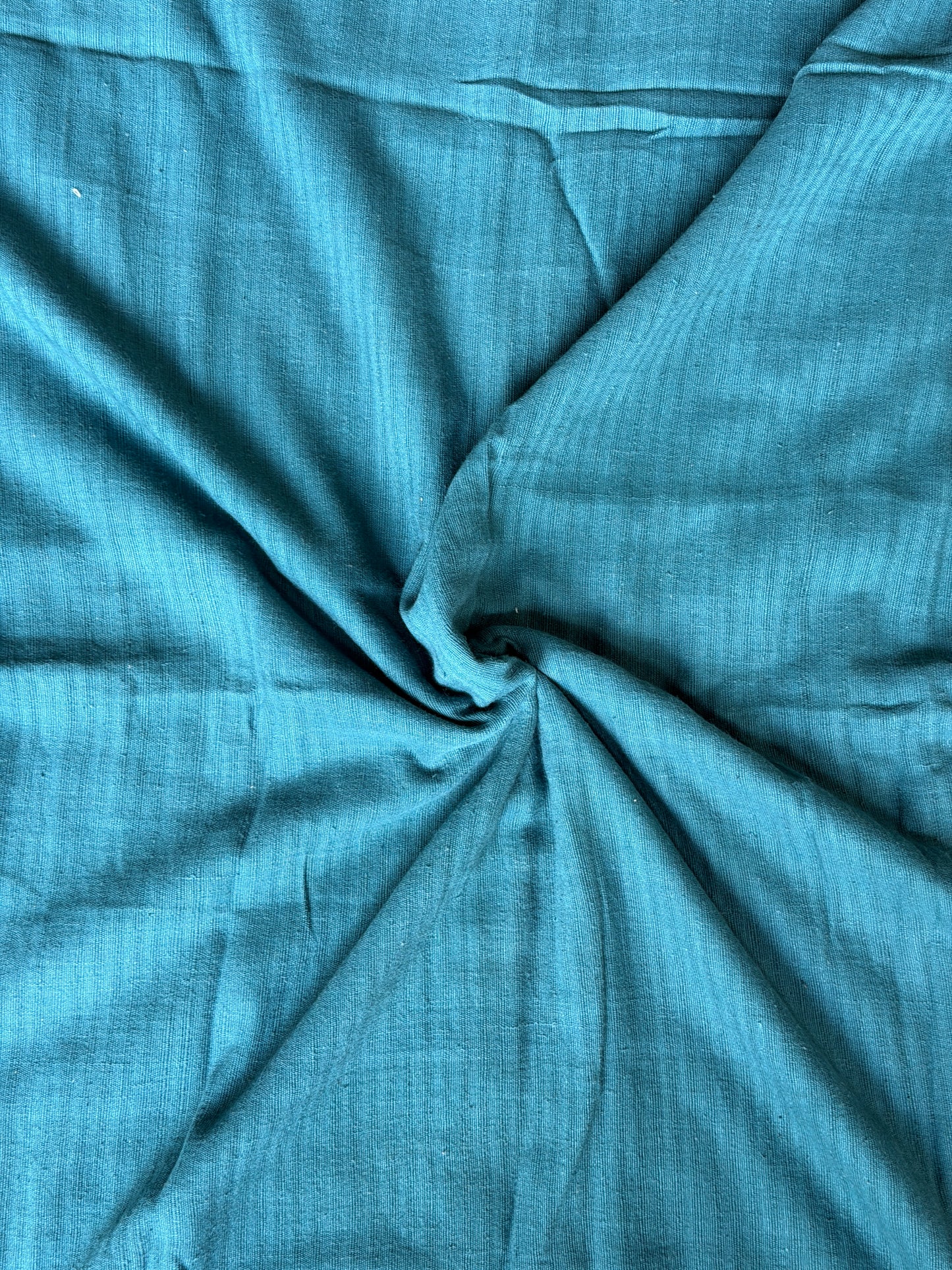 Teal blue cotton hand spun, hand woven fabric with missing thread stripes weave
