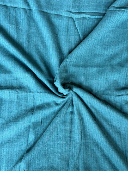 Teal blue cotton hand spun, hand woven fabric with missing thread stripes weave