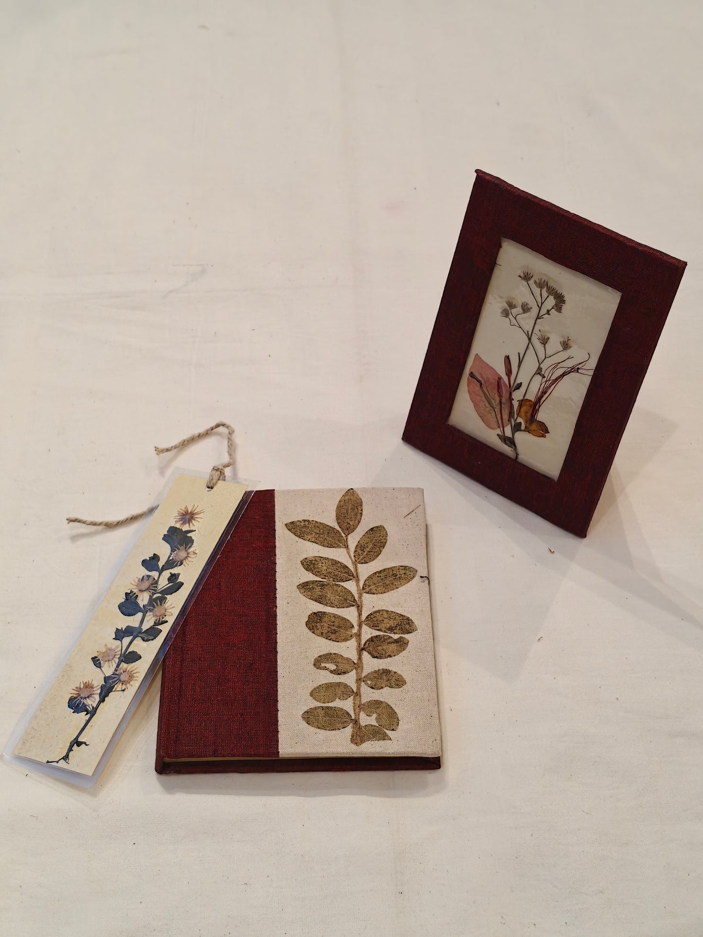 Handmade paper notebook with eco leaf printed fabric cover, hand crafted bookmark with dried flowers and a table frame pouch set