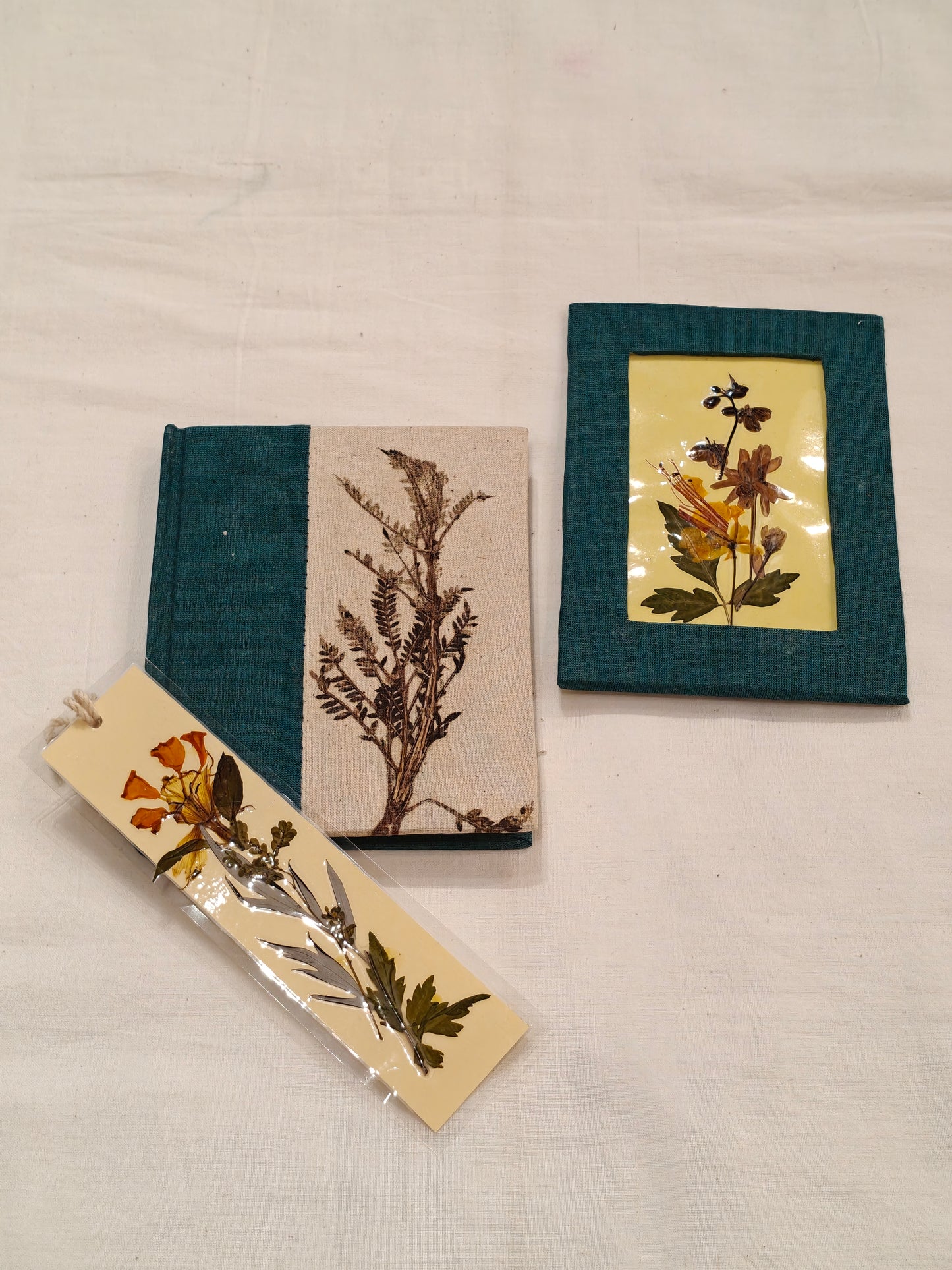Handmade paper notebook with eco leaf printed fabric cover, hand crafted bookmark with dried flowers and a table frame pouch set