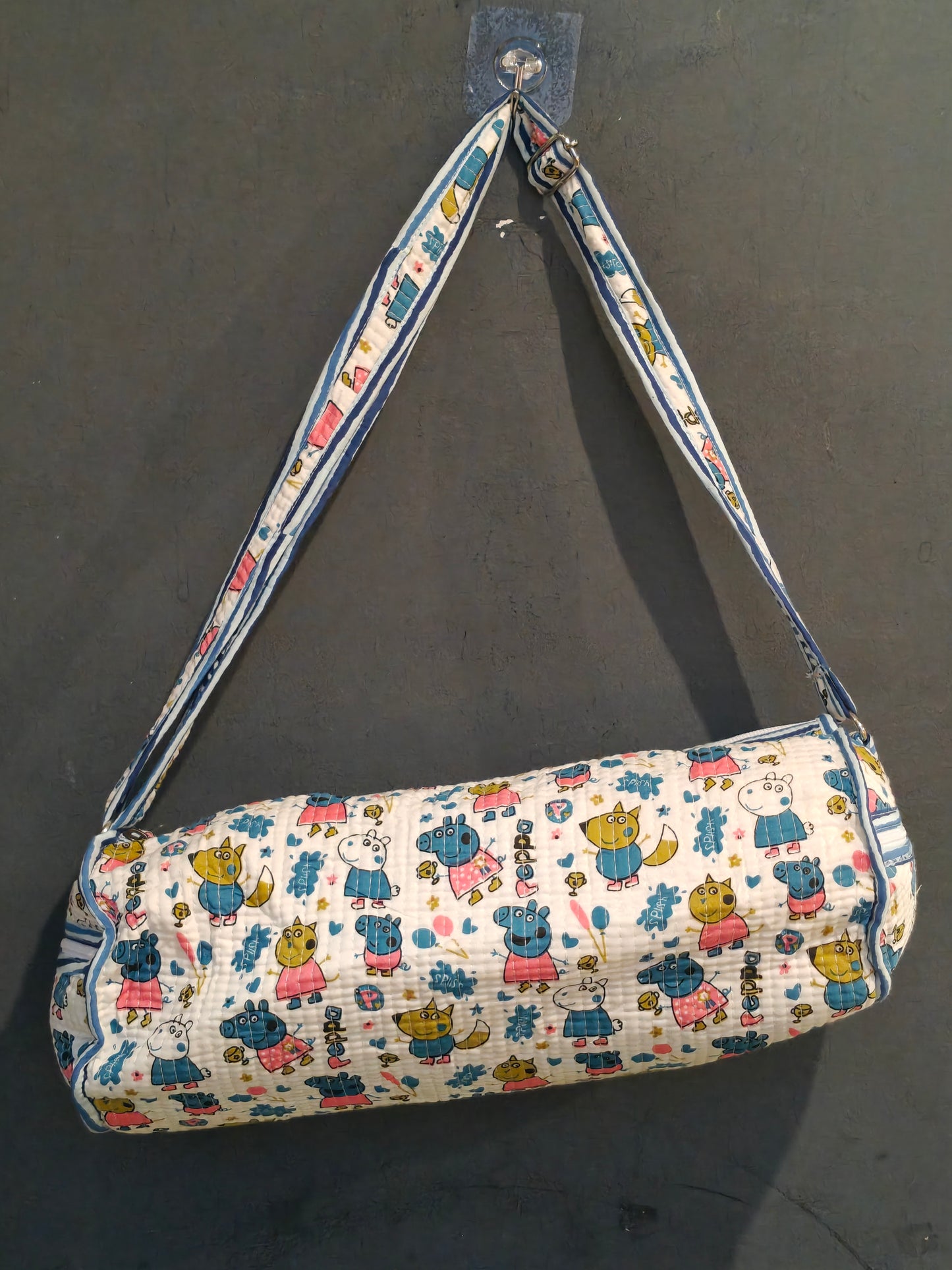 Water proof lined travel and swimming duffle bag in hand block printed, quilted cotton