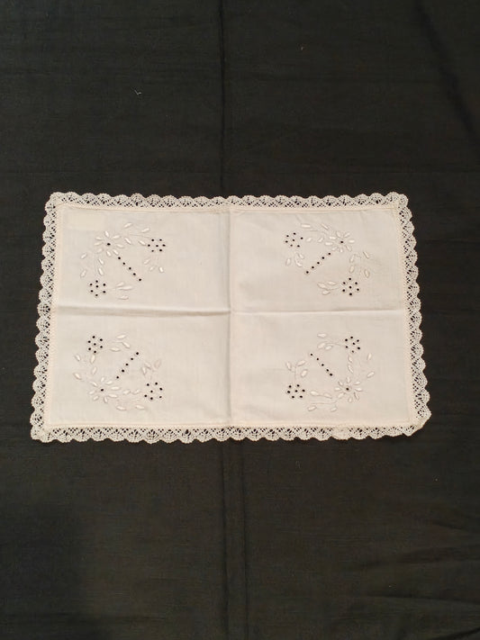 White cotton embroidered and cutworked table placemats with lace borders