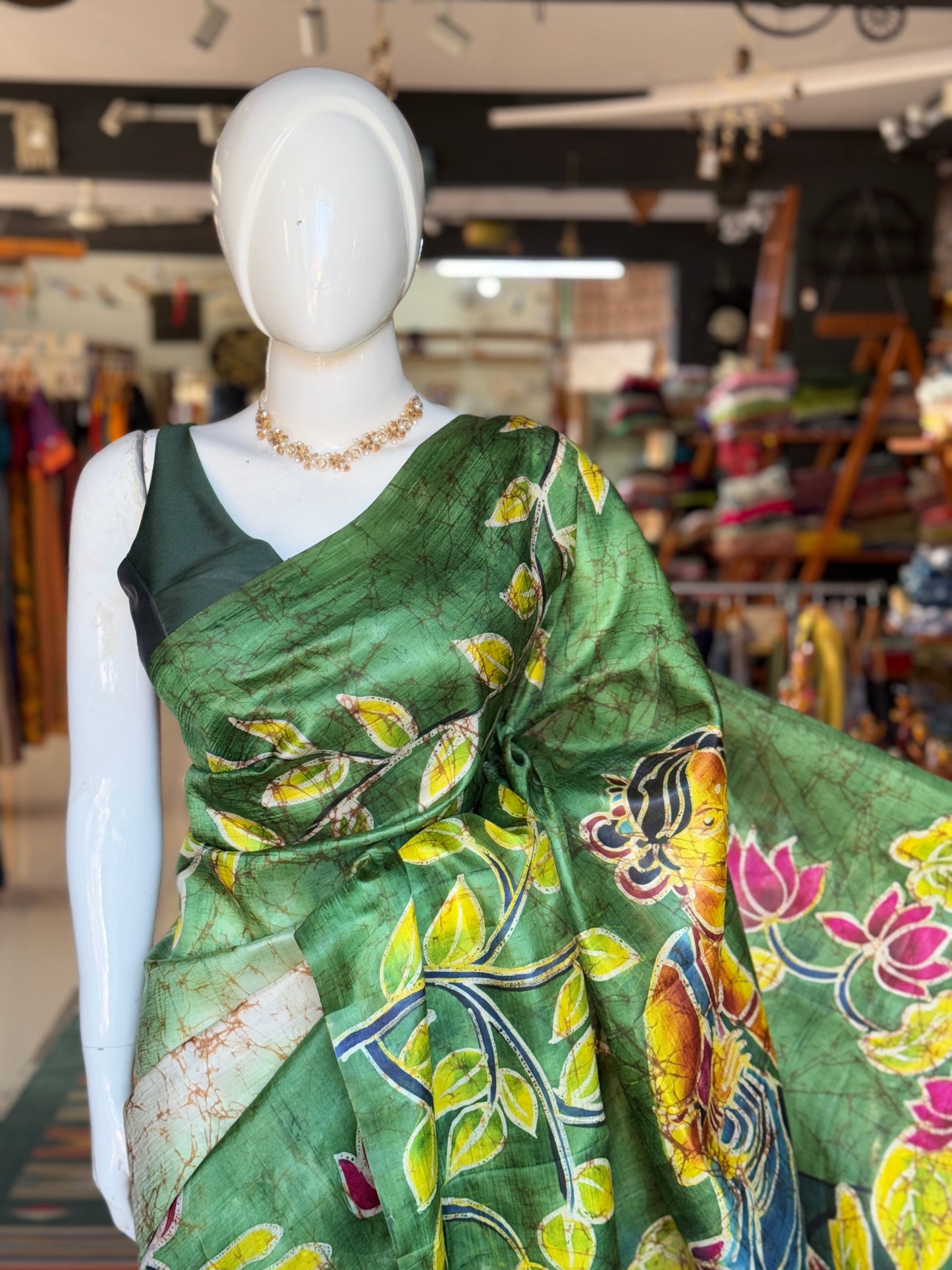 Off white and green hand painted Batik pure katan silk saree - lady with flowers on pallu