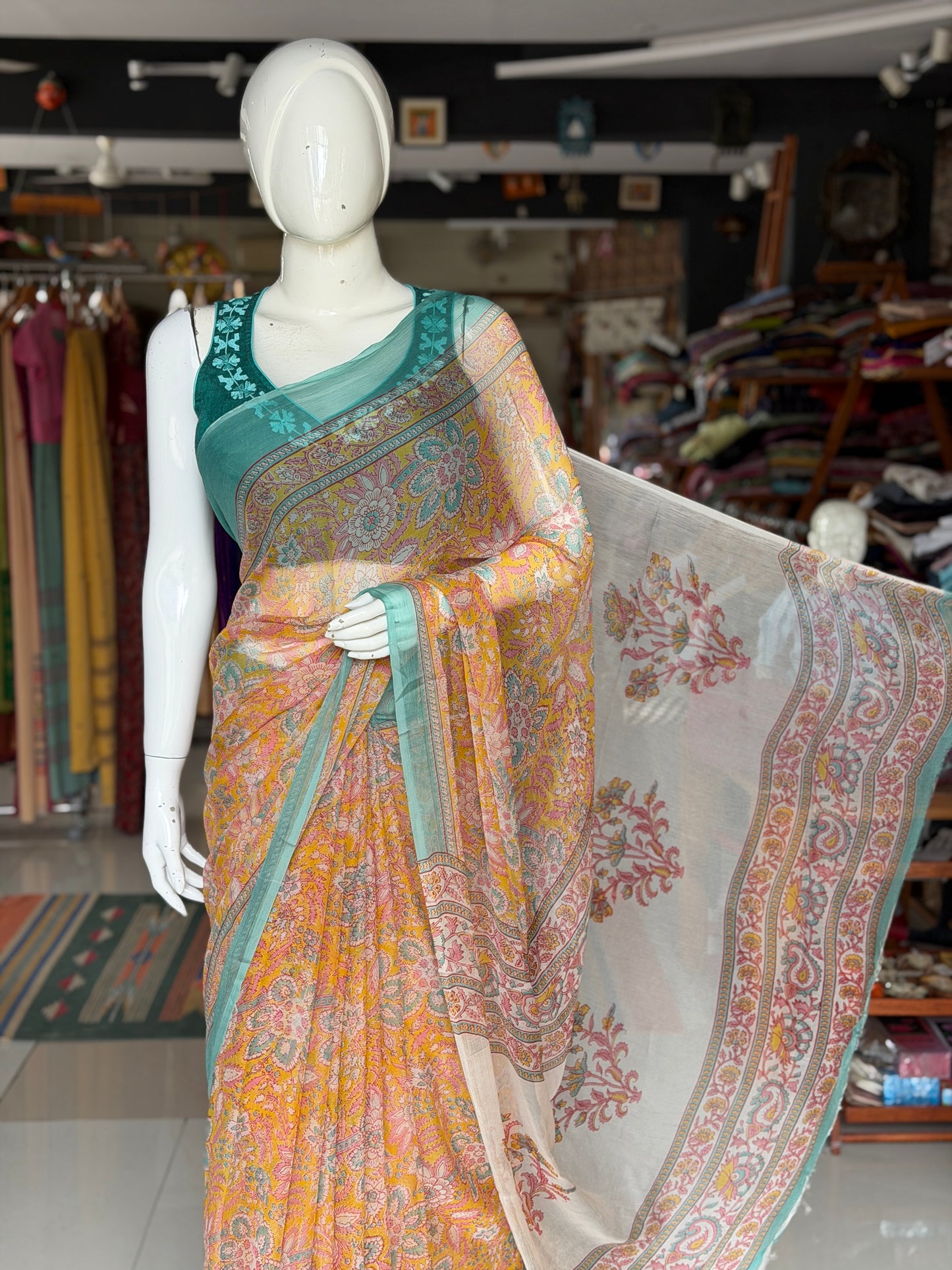 Mustard yellow Chiffon floral printed saree with teal border