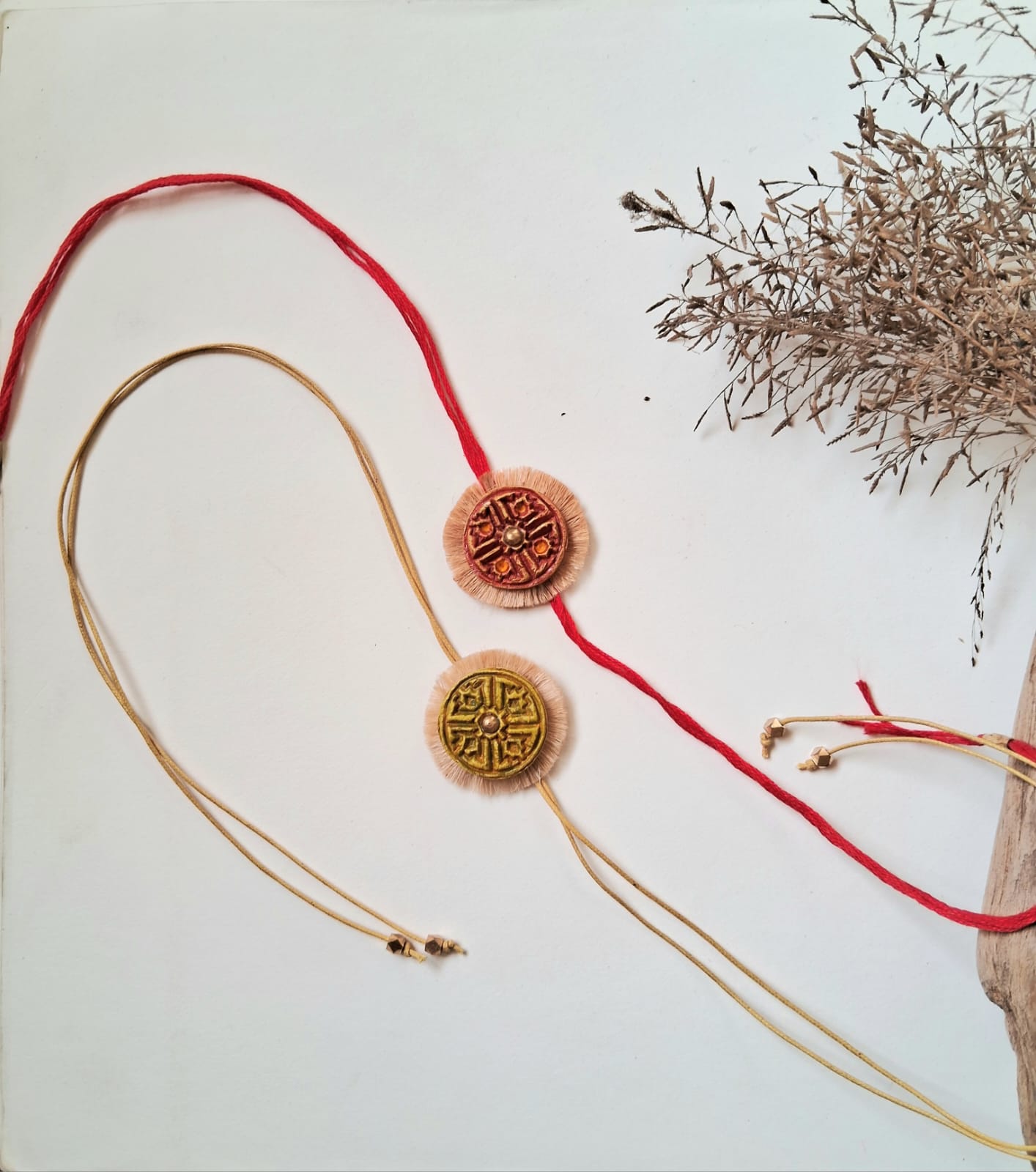 Papier mache hand crafted designer rakhi with metal embellishments