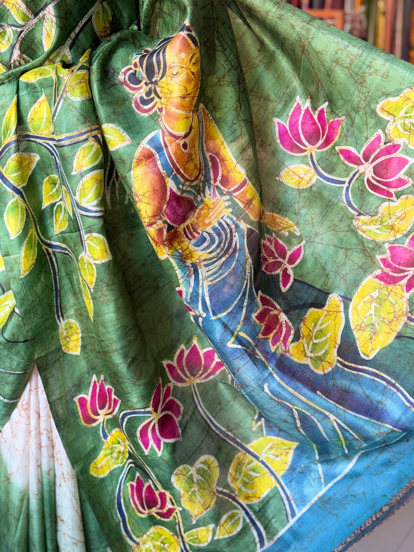 Off white and green hand painted Batik pure katan silk saree - lady with flowers on pallu