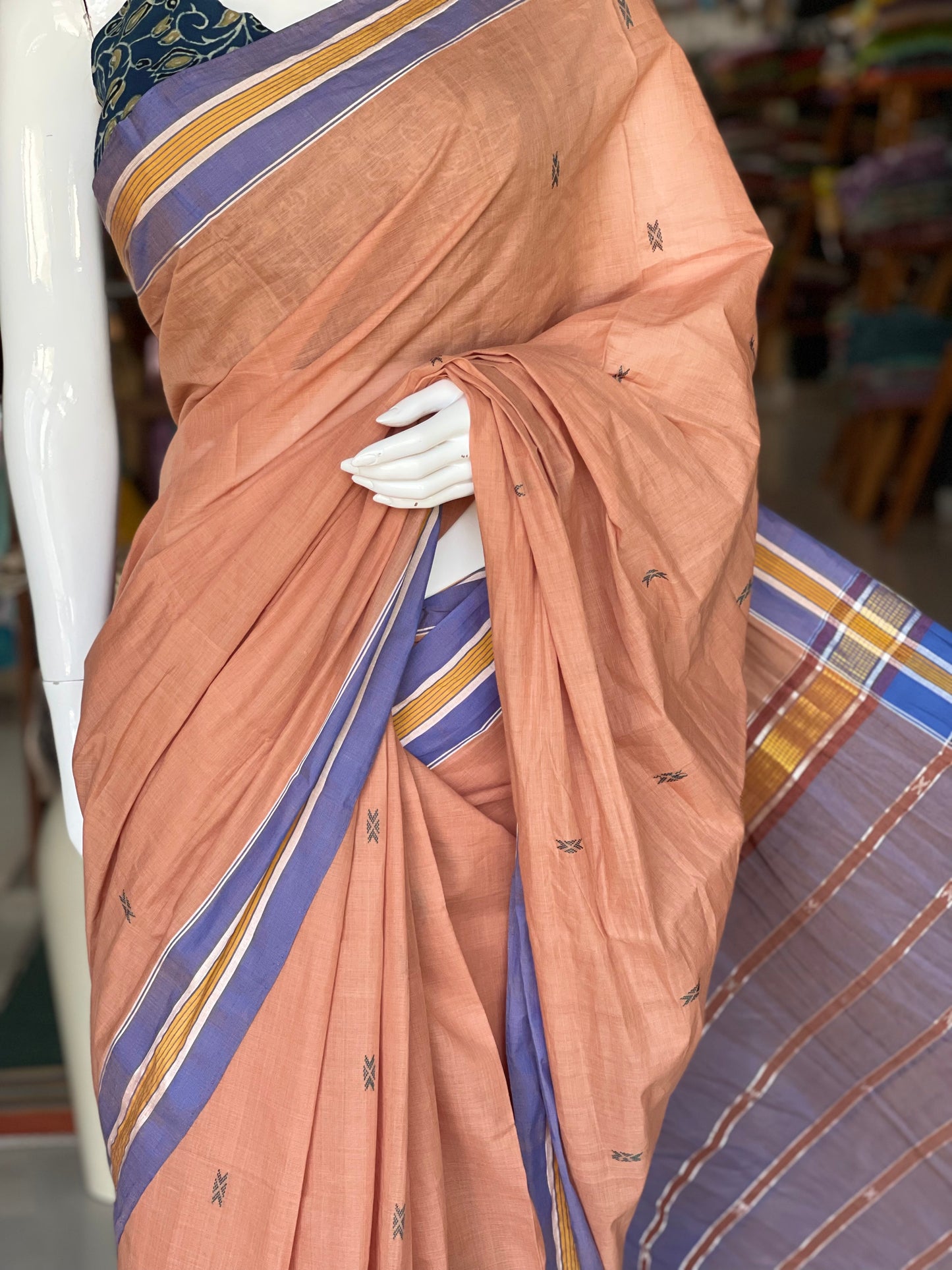 Peach handwoven cotton saree with butis all over and stripes palla