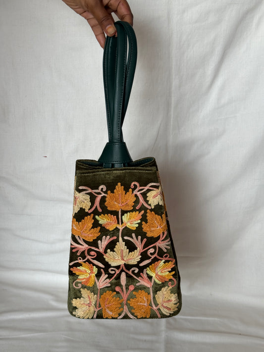 Potli bags with Kashmiri floral Aari embroidery - interesting twist around handle button closure